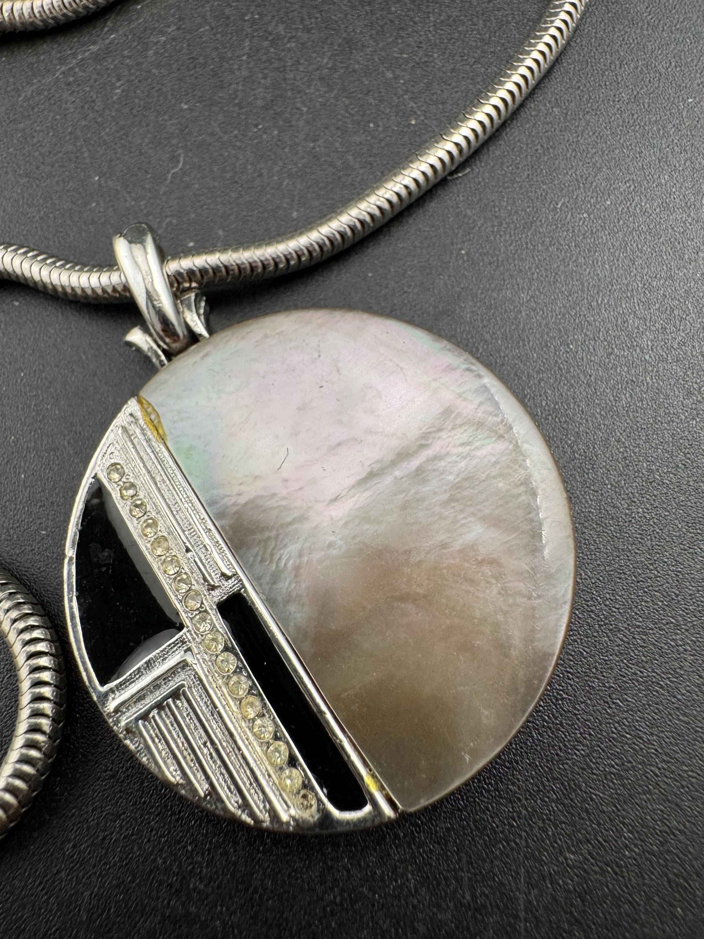 Signed MANDLE black enamel mother of pearl disc pendant on a snake chain necklace