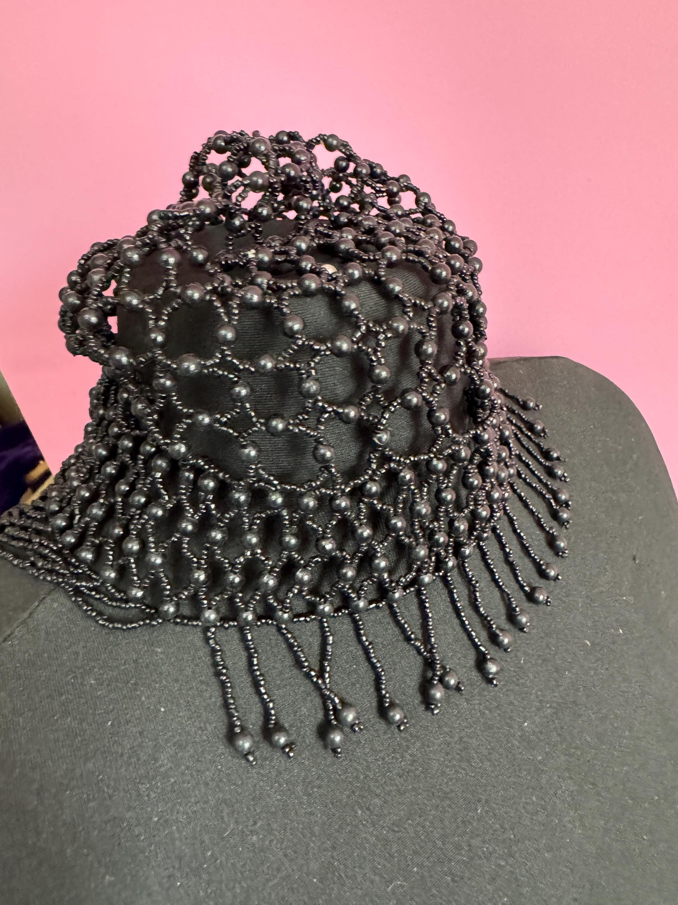 Quirky black head piece bead cloche headress