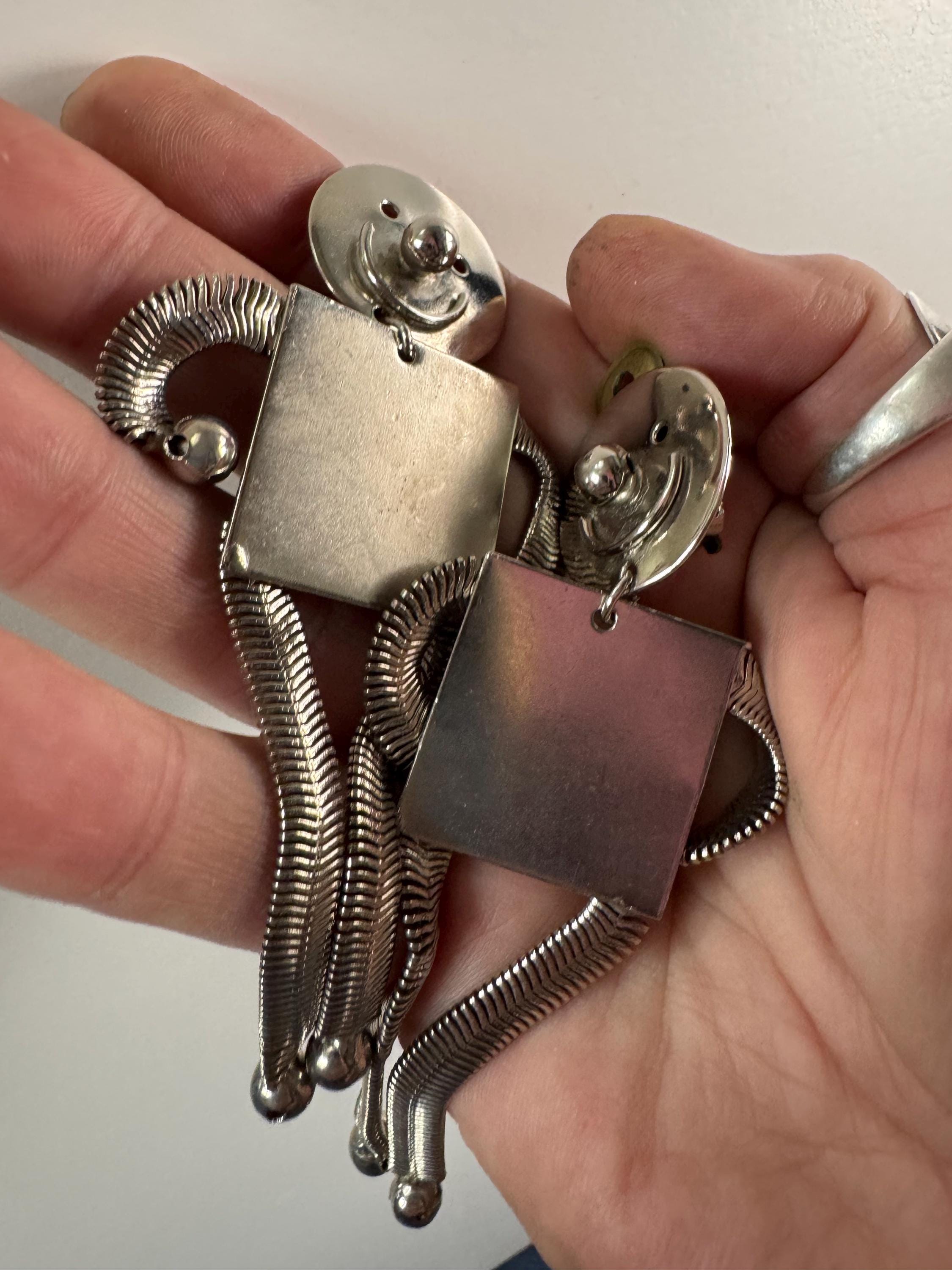 vintage novelty long robot clip on earrings , silver tone articulated