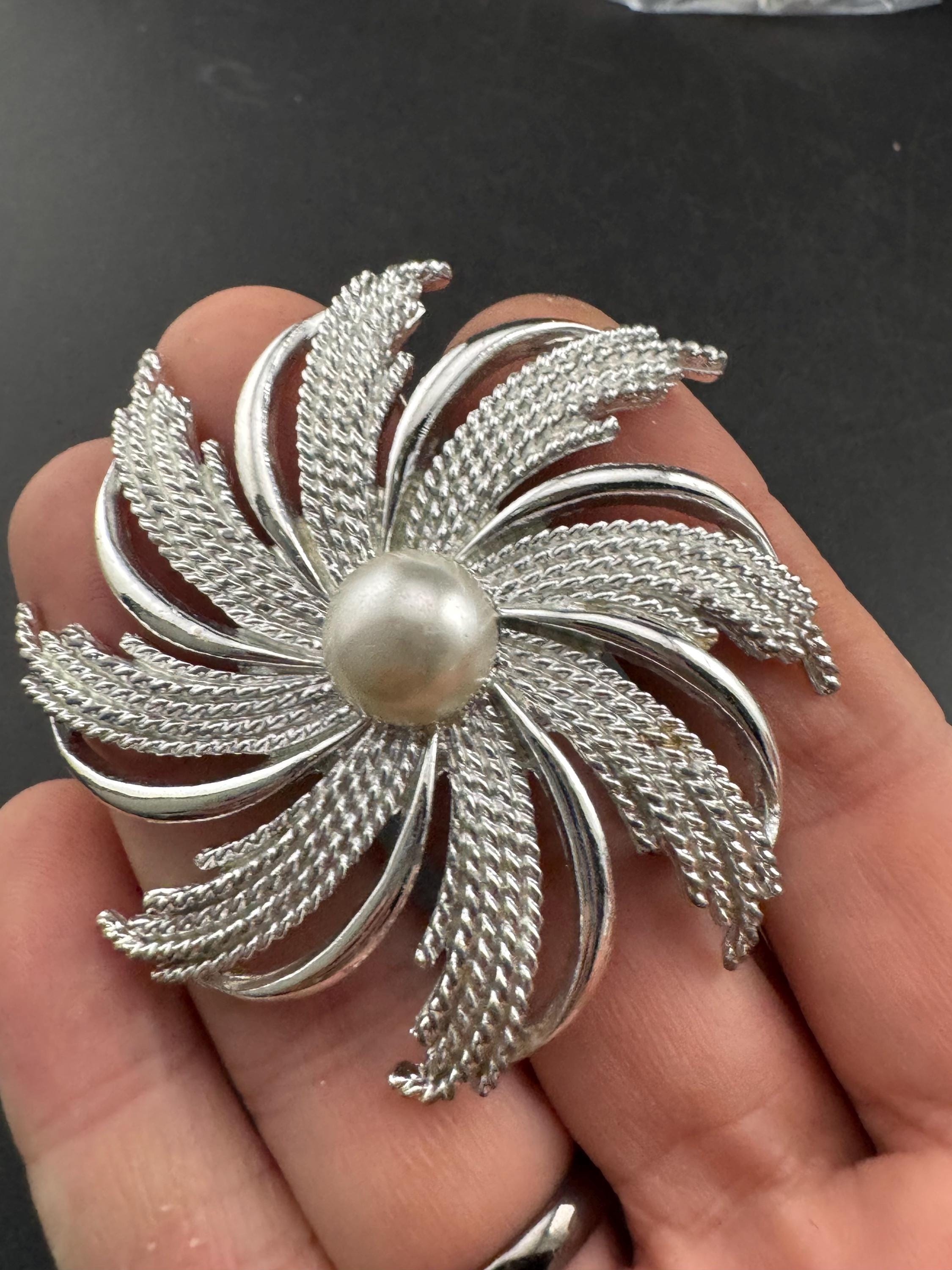 vintage large Sarah Coventry pinwheel brooch, silver tone with central pearl
