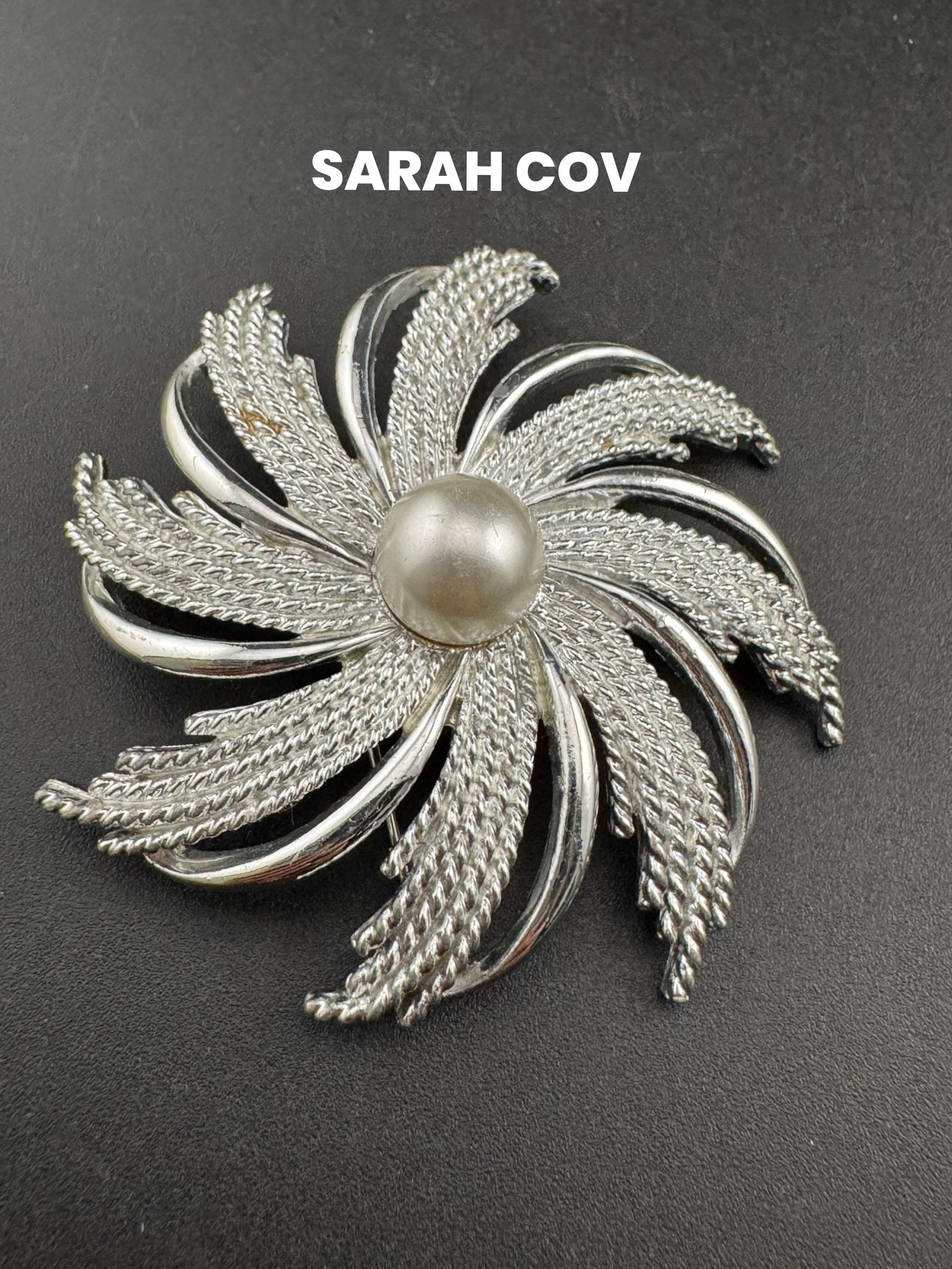 vintage large Sarah Coventry pinwheel brooch, silver tone with central pearl