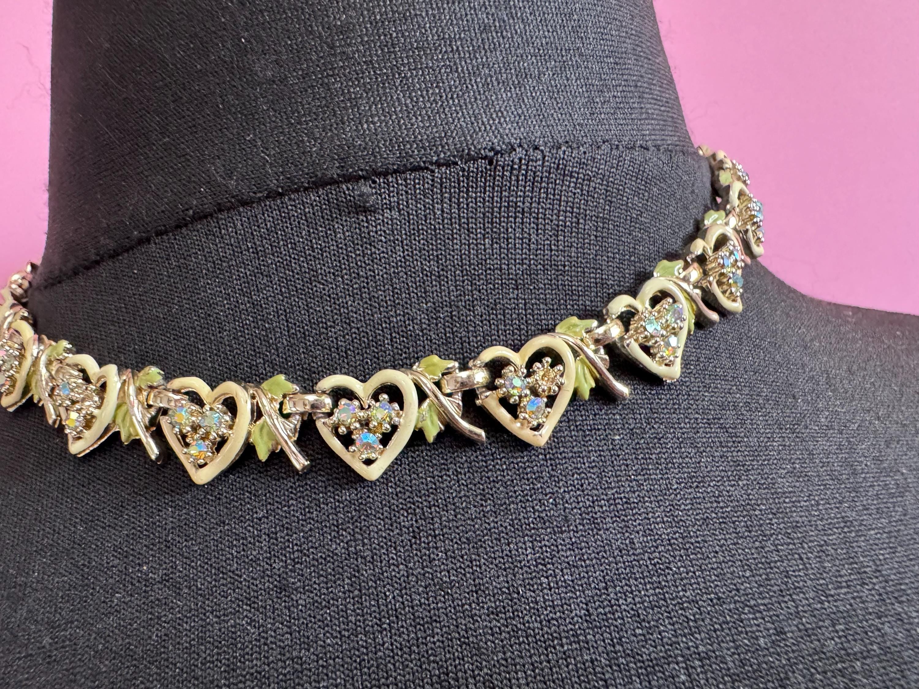 Vintage Aurora borealis and cream enamel heart necklace, light gold tone with rhinestone