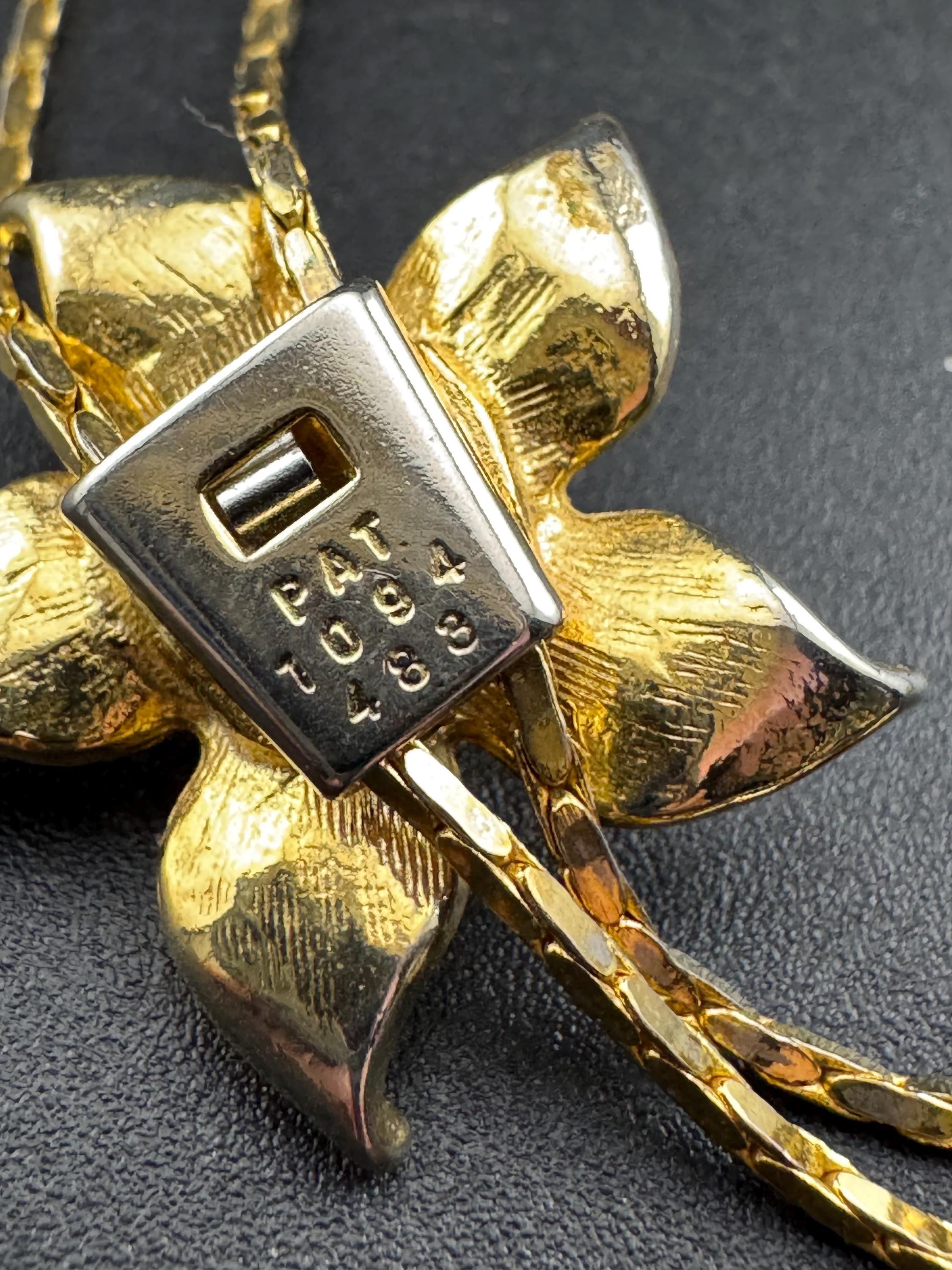 Vintage flower crystal slider bolo necklace, with pat no , gold plated