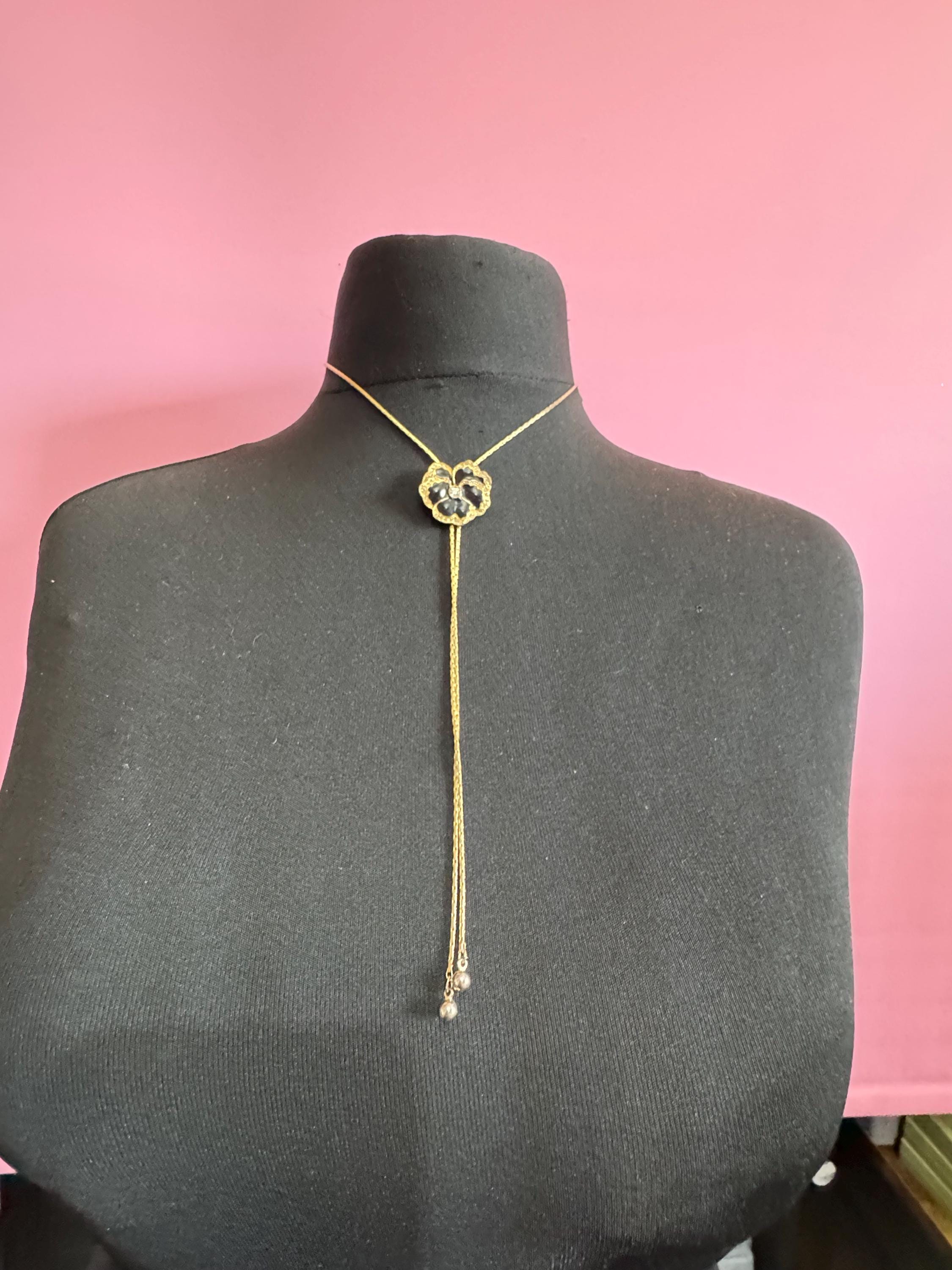 Vintage black enamel and crystal floral slider bolo necklace, with pat no , gold plated