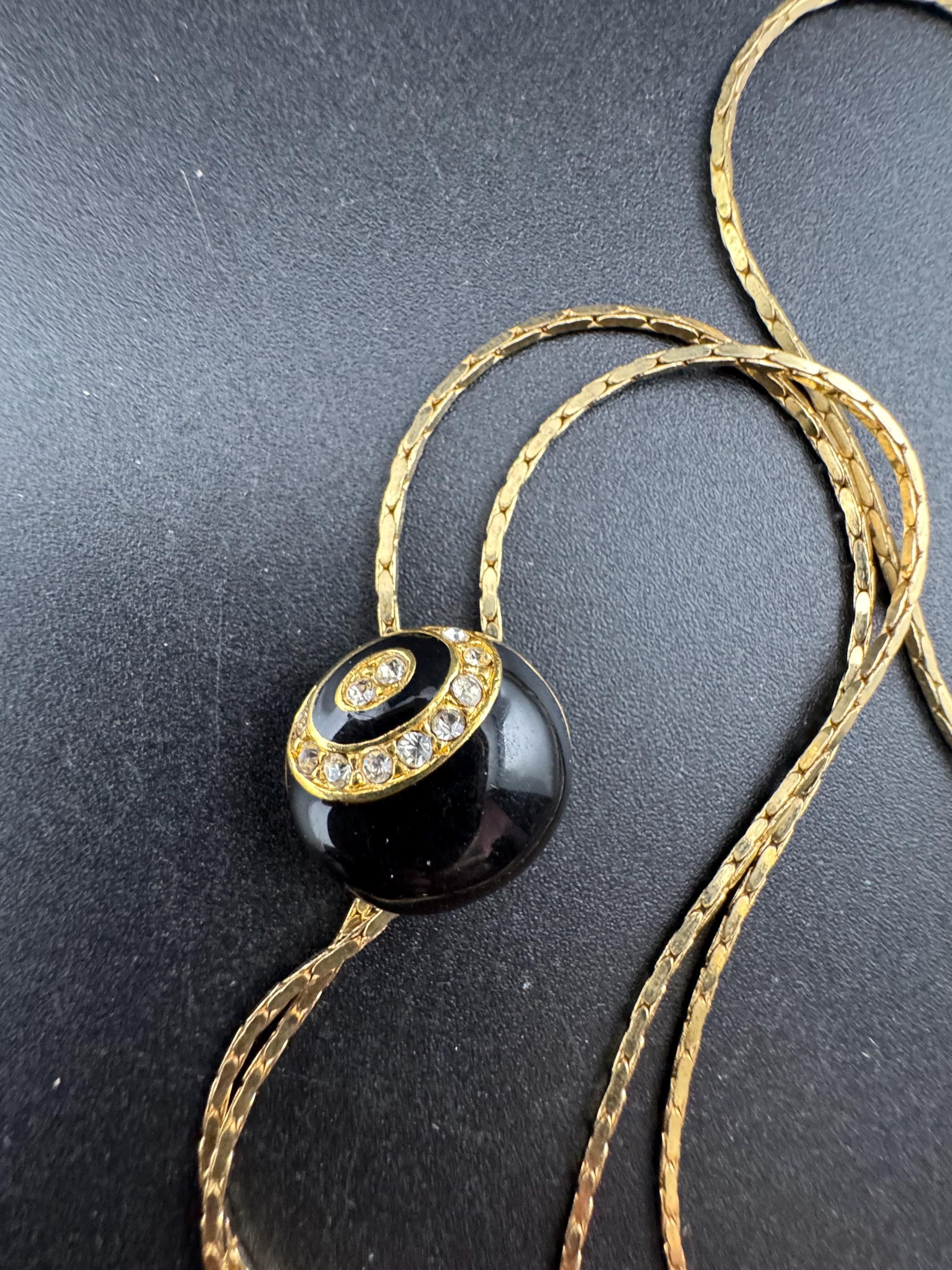 Vintage black enamel and crystal slider bolo necklace, with pat no , gold plated