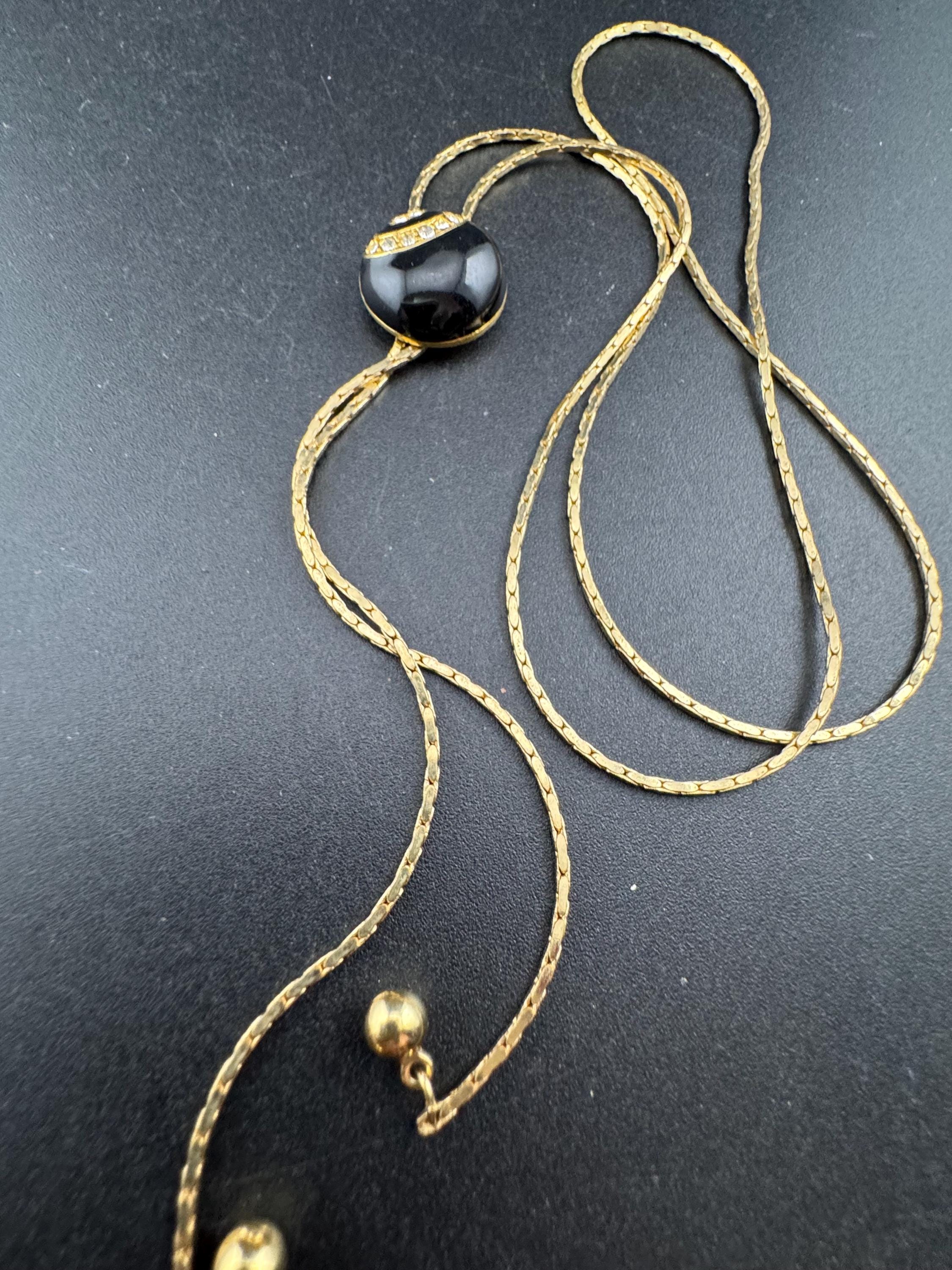 Vintage black enamel and crystal slider bolo necklace, with pat no , gold plated