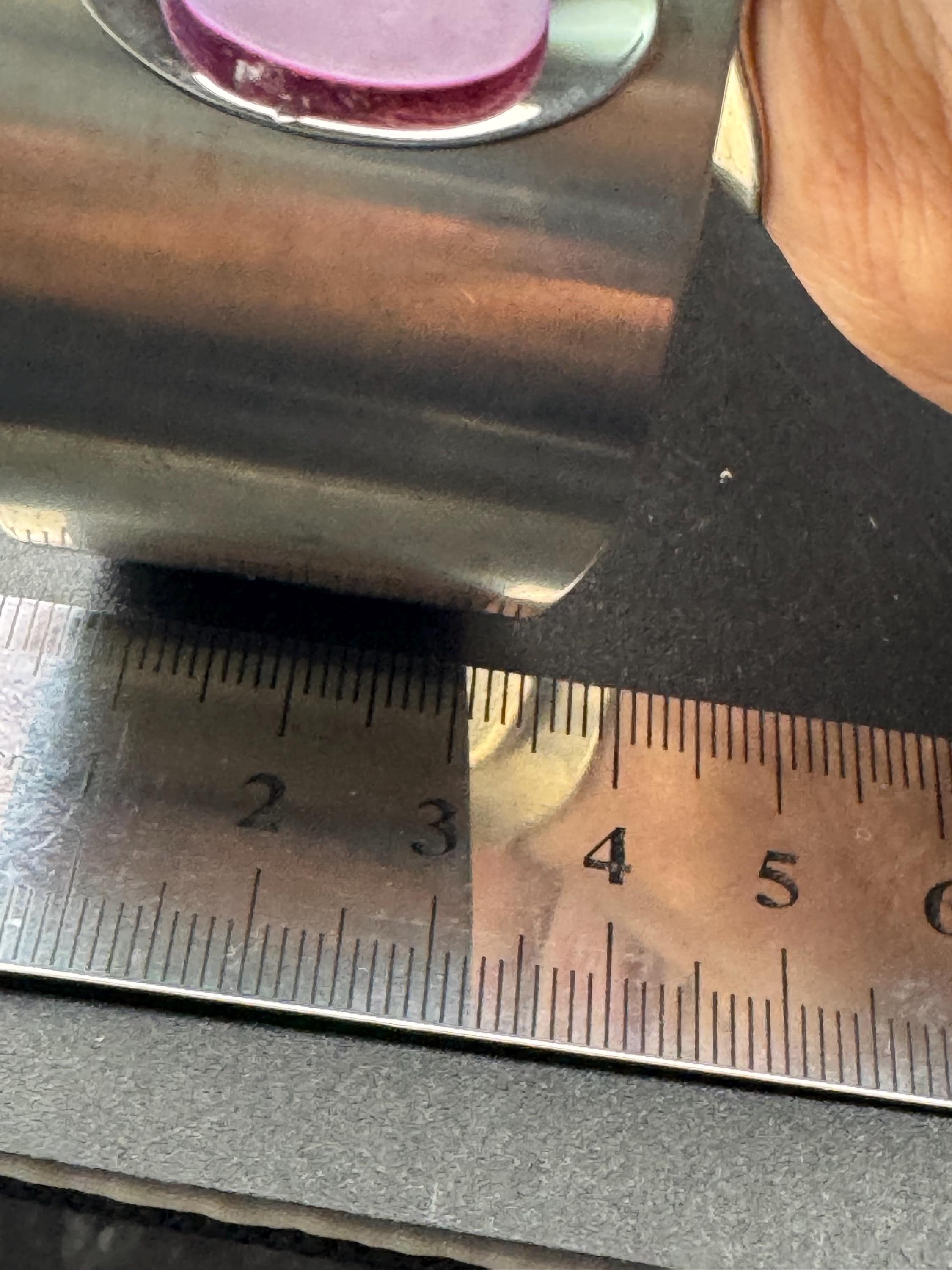 1970s stainless steel bangle, set with purple shell cabochon