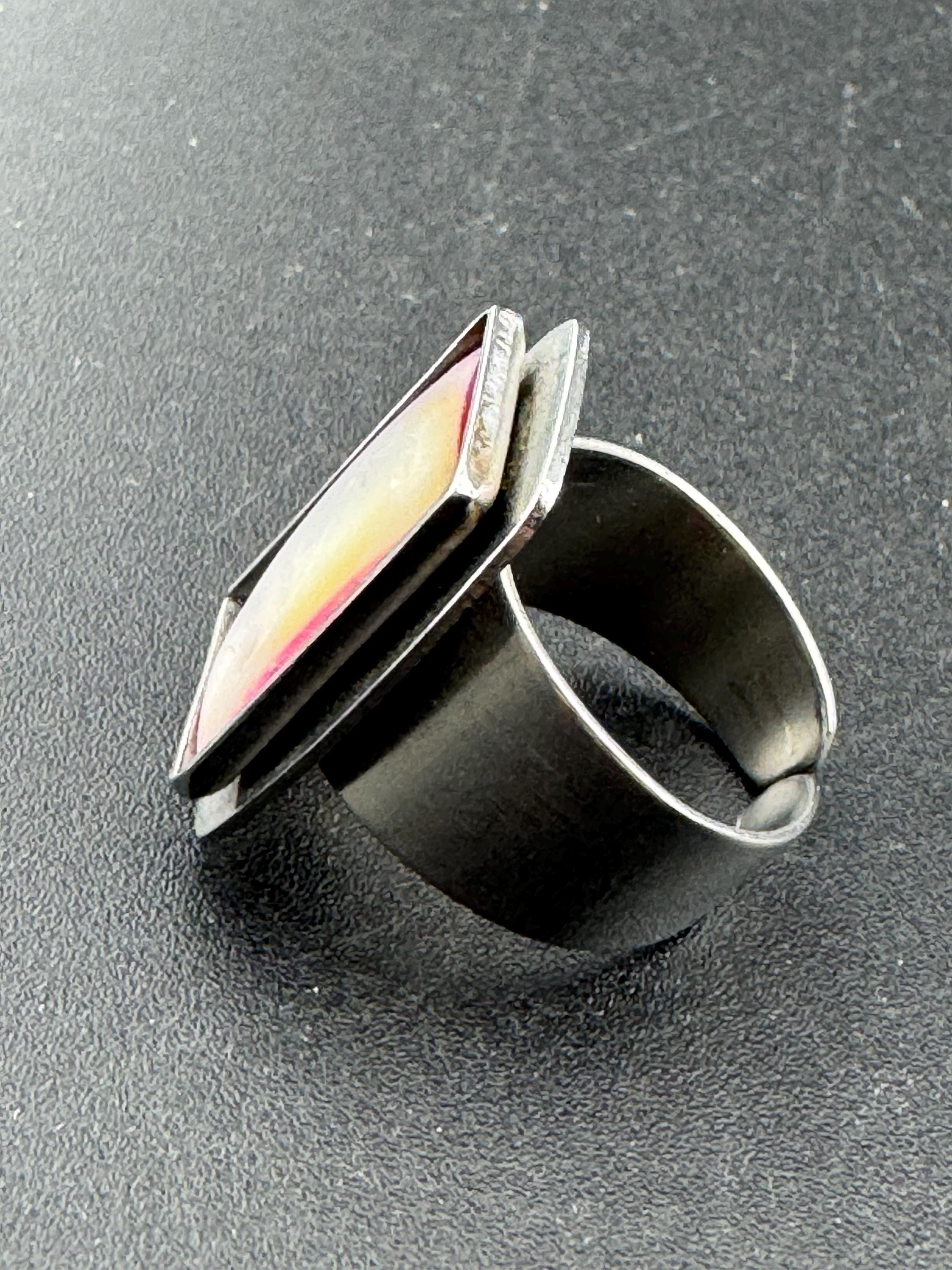 1970s Lord python stainless steel adjustable ring, set with pink shell cabochon, vintage