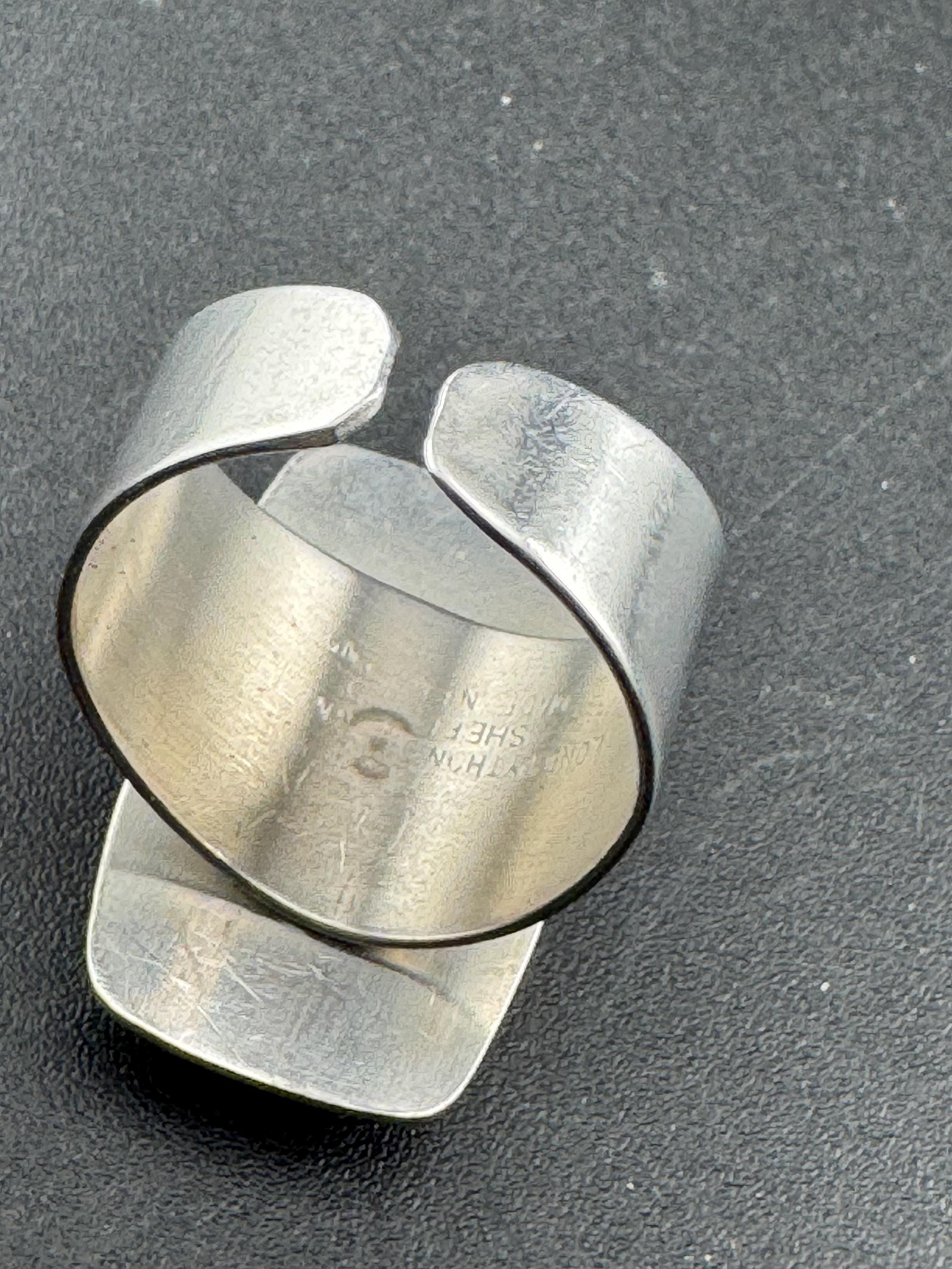 1970s Lord python stainless steel adjustable ring, set with pink shell cabochon, vintage