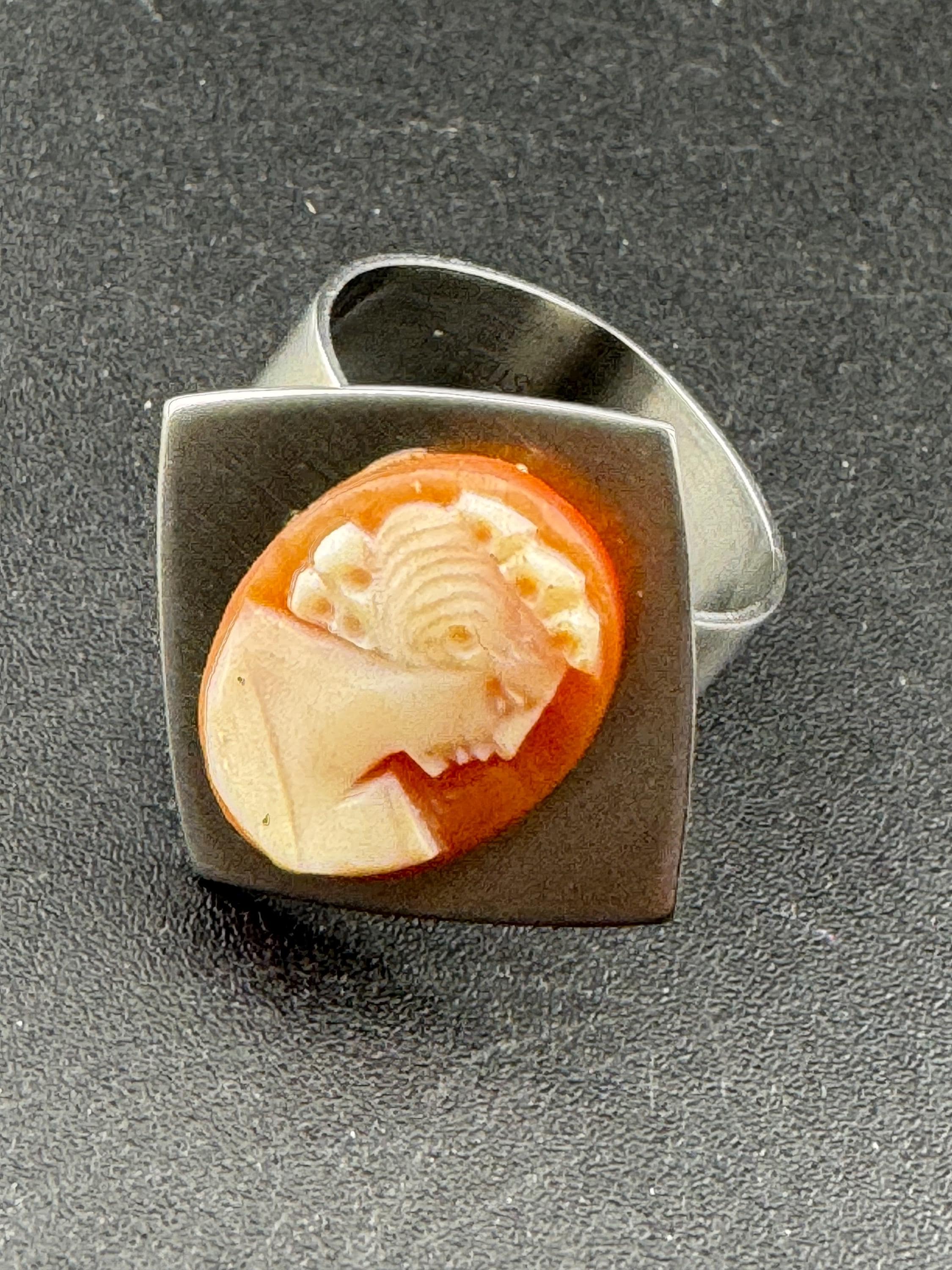1970s stainless steel adjustable ring, with carved shell cameo