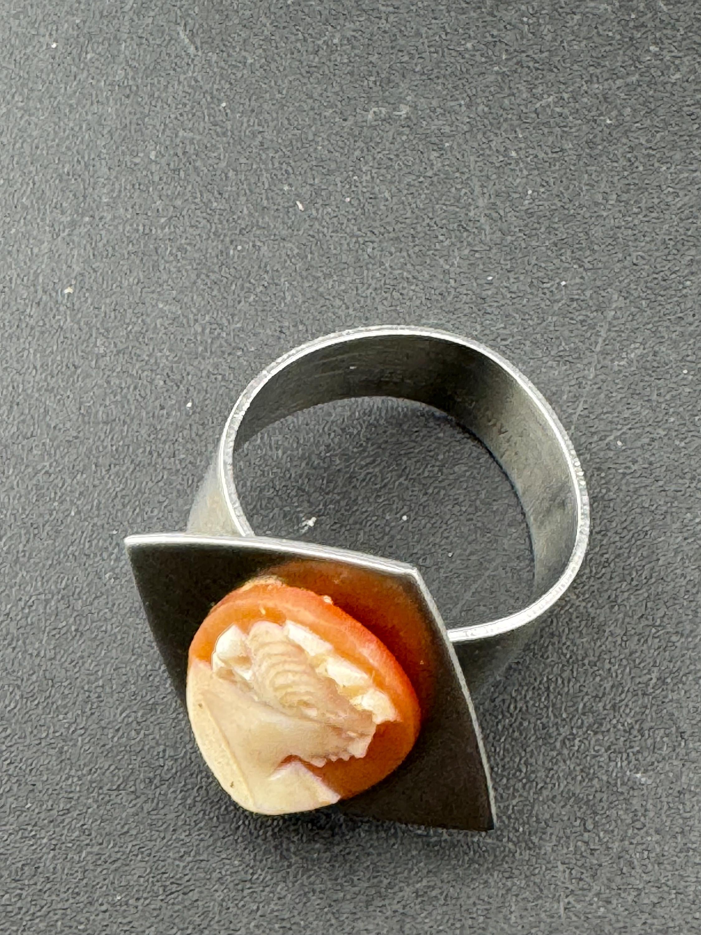 1970s stainless steel adjustable ring, with carved shell cameo