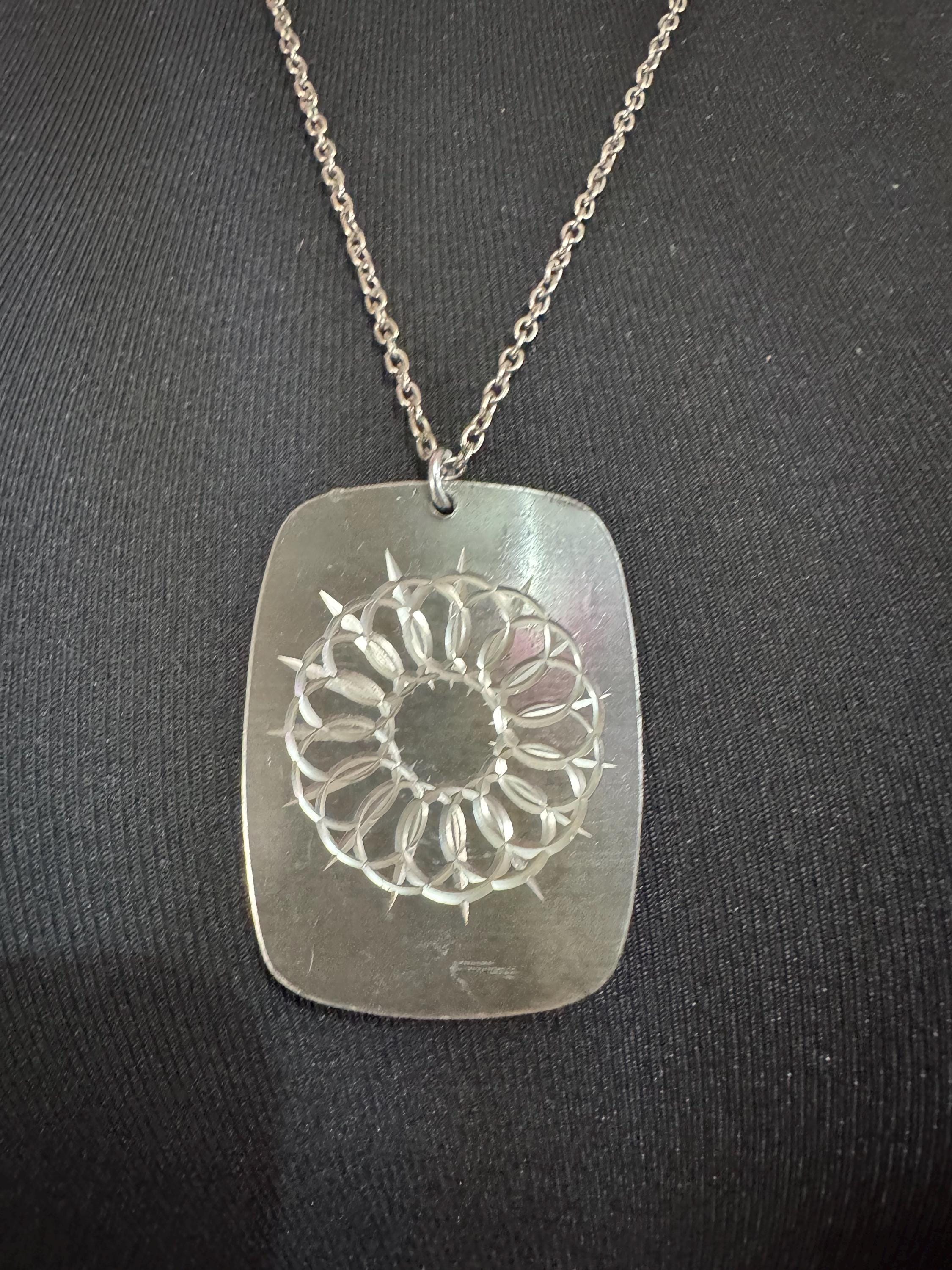 Vintage 1970s stainless steel etched pendant on a 68cm chain