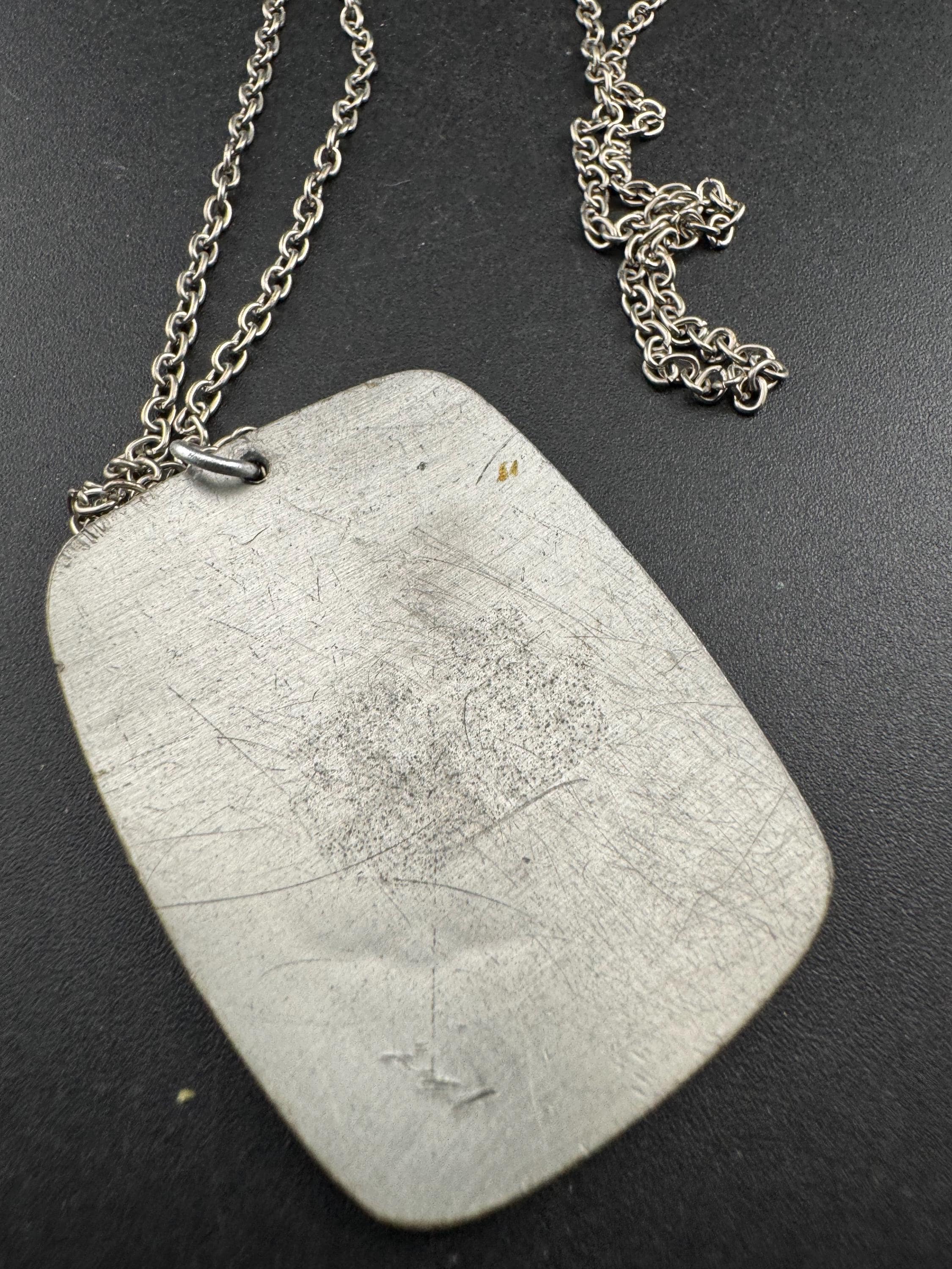 Vintage 1970s stainless steel etched pendant on a 68cm chain