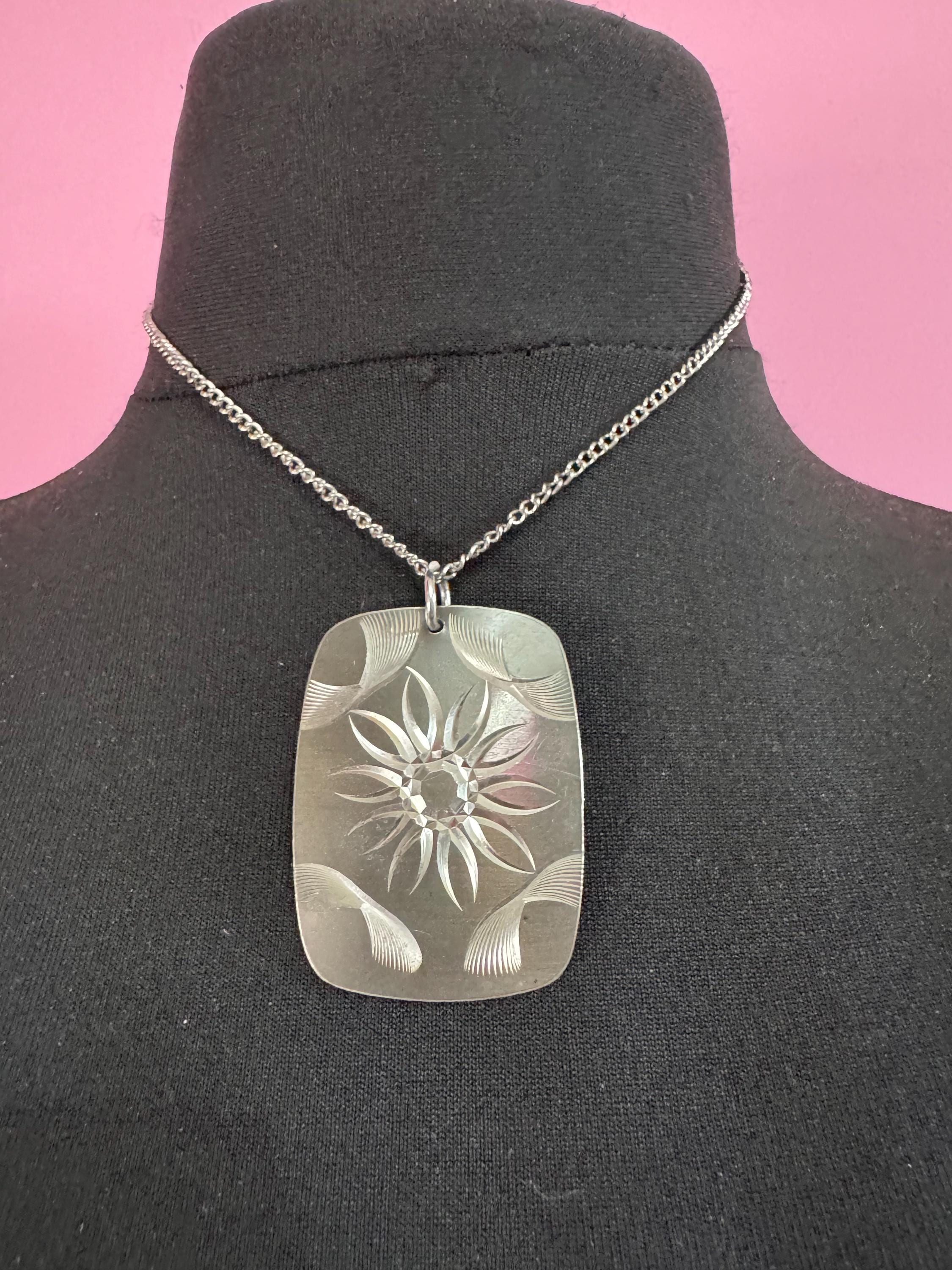 Vintage 1970s stainless steel etched pendant on a 41cm chain