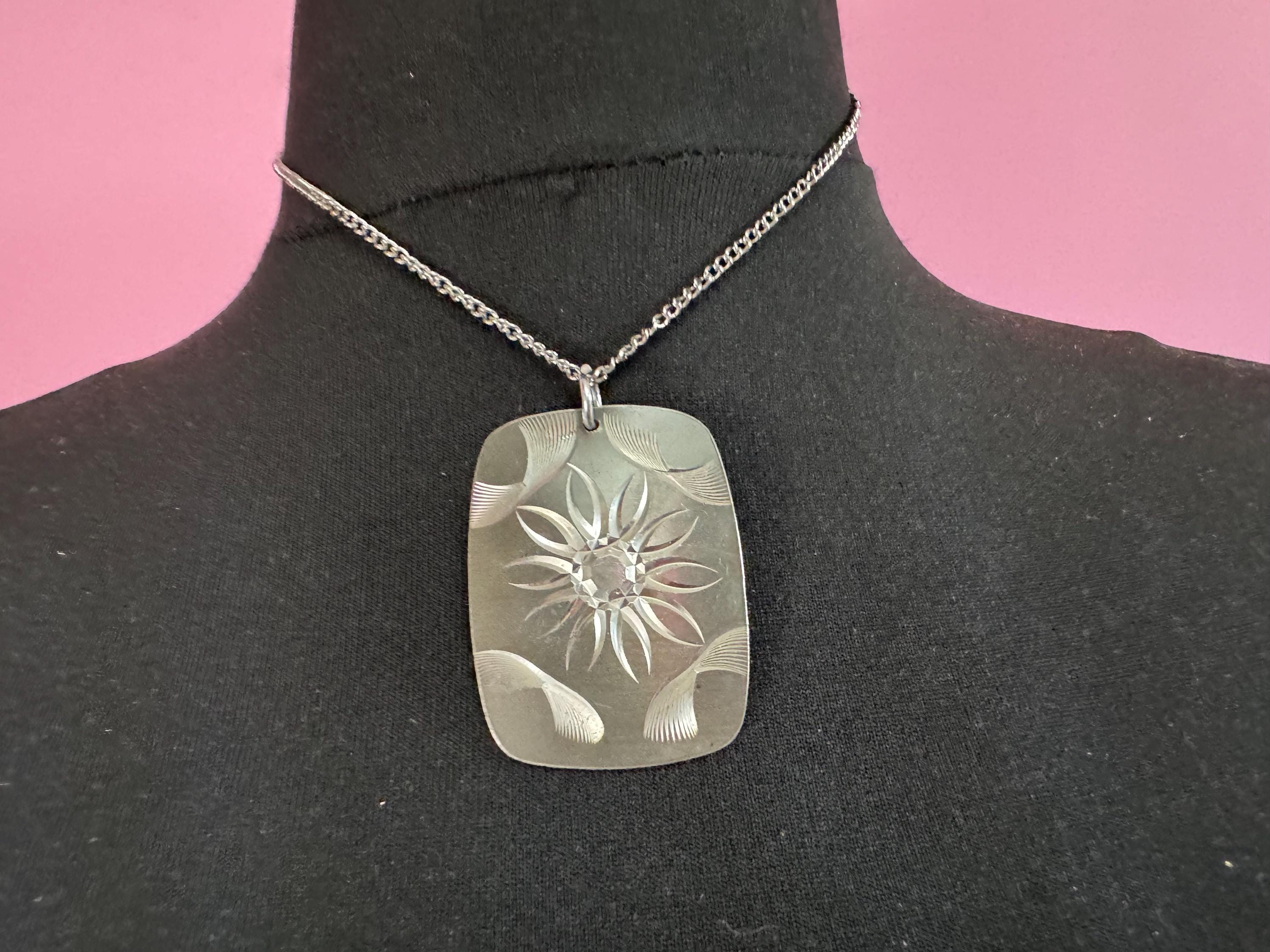 Vintage 1970s stainless steel etched pendant on a 41cm chain