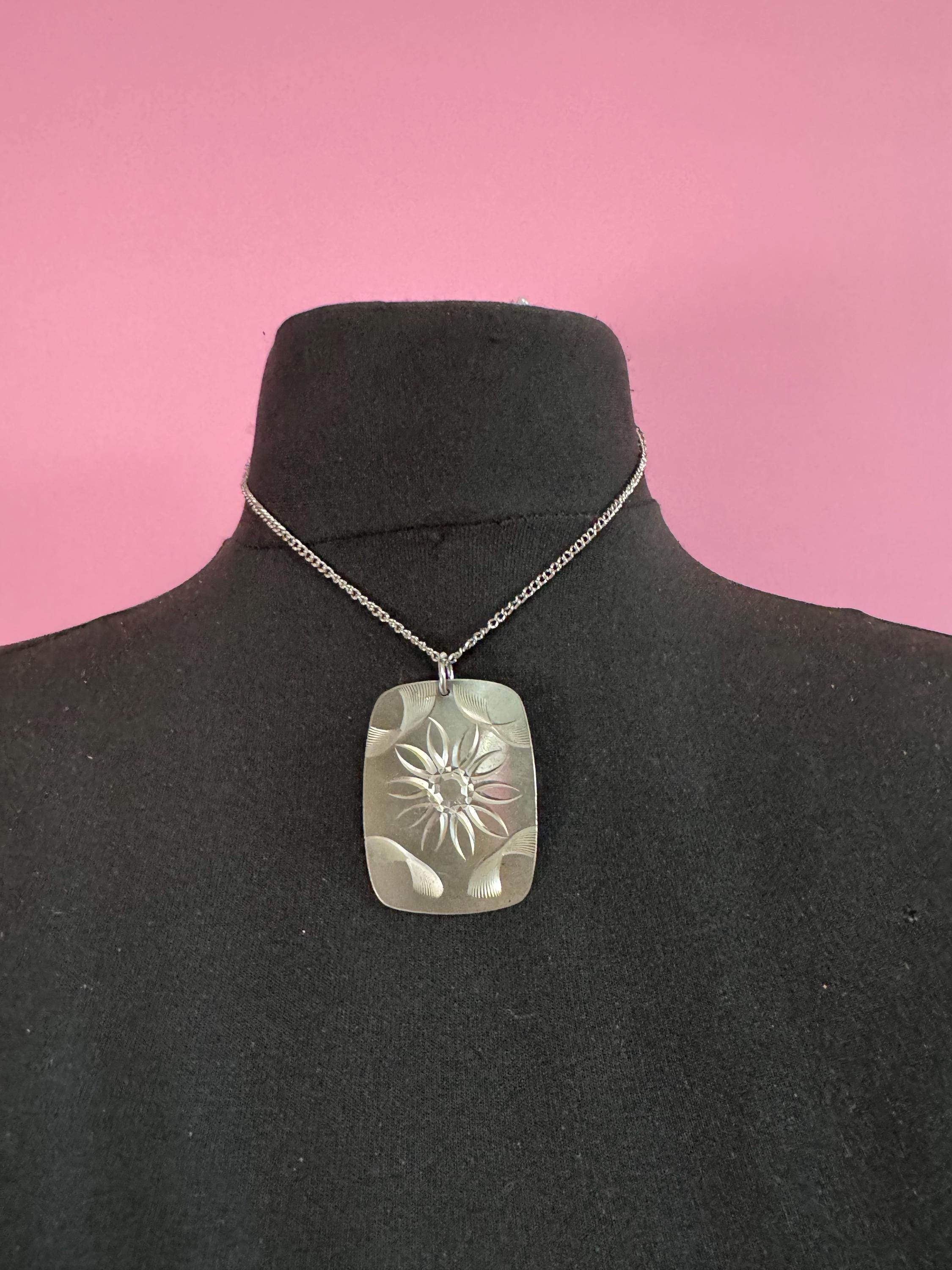 Vintage 1970s stainless steel etched pendant on a 41cm chain