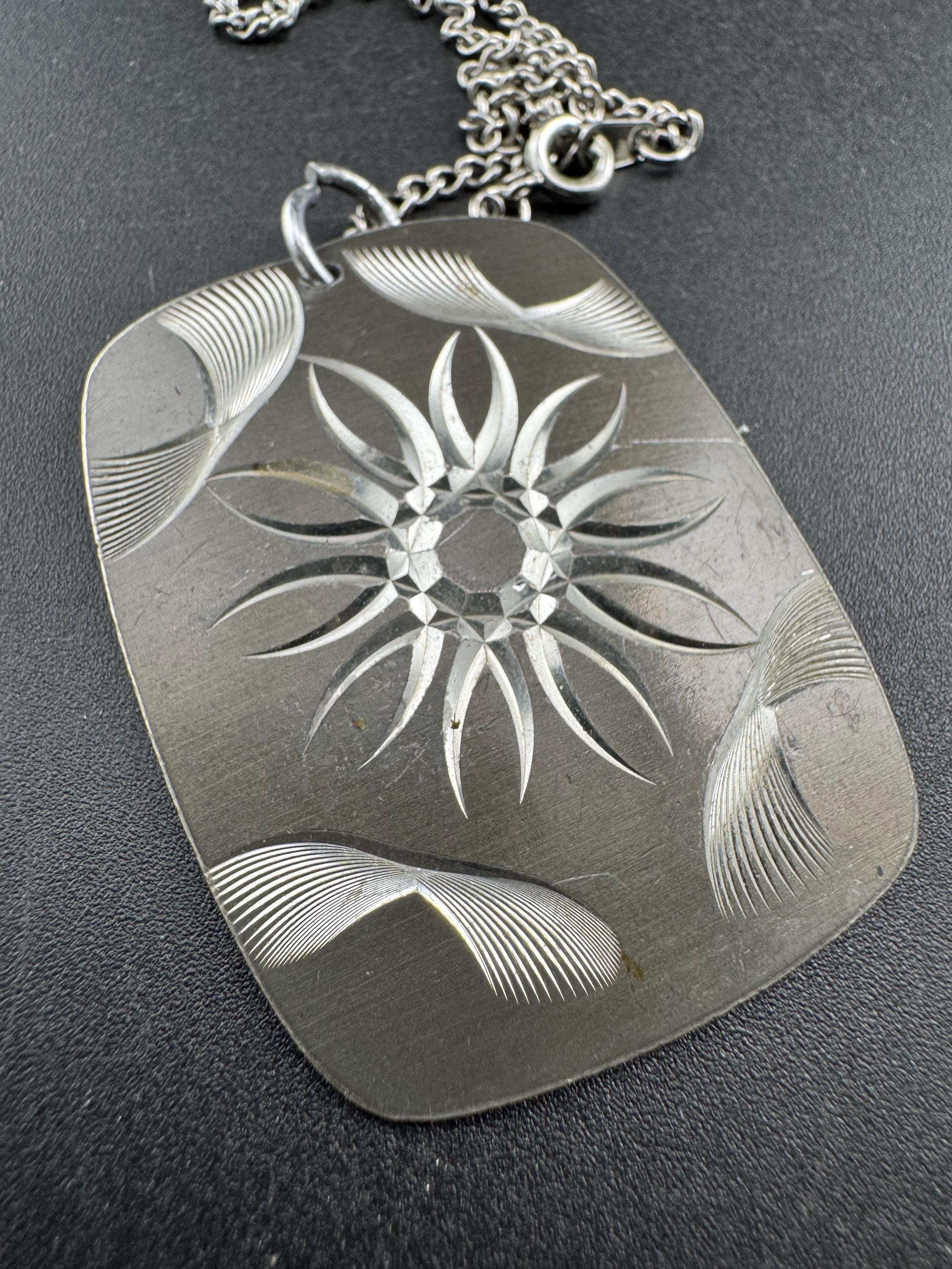 Vintage 1970s stainless steel etched pendant on a 41cm chain