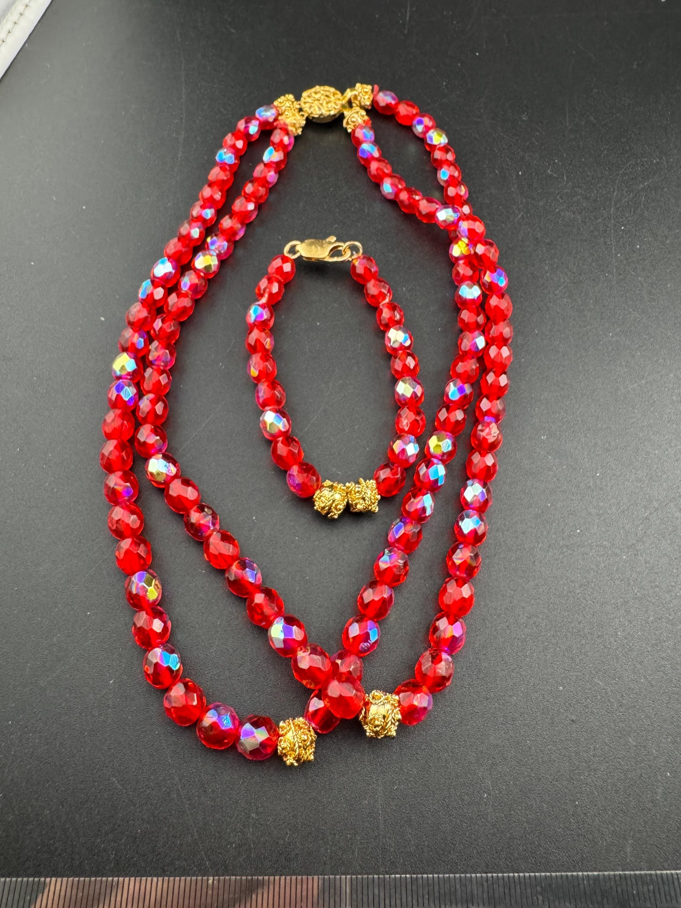 Red glass beaded crystal Multistrand  necklace and matching bracelet, faceted beads gold tone