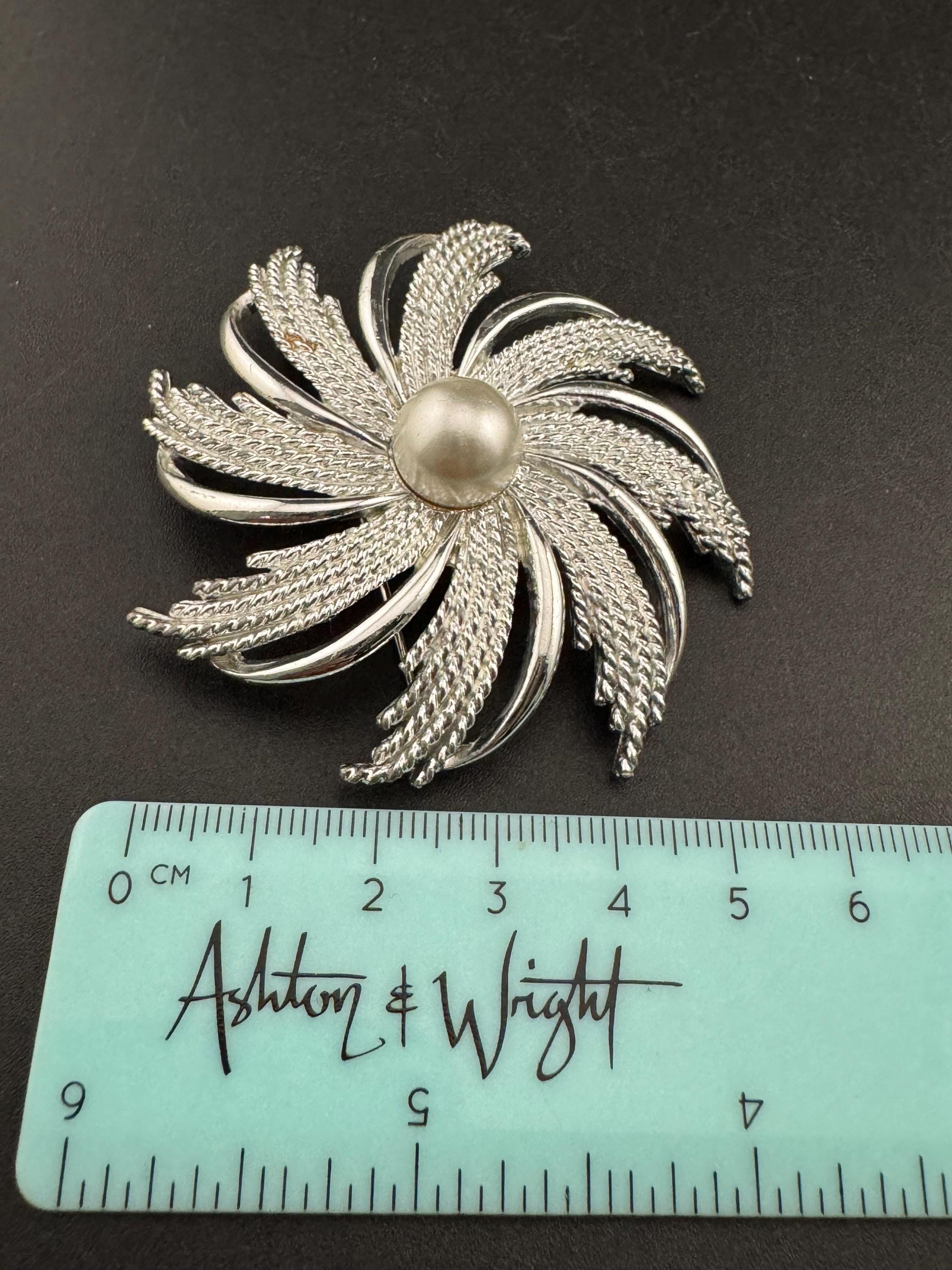 vintage large Sarah Coventry pinwheel brooch, silver tone with central pearl