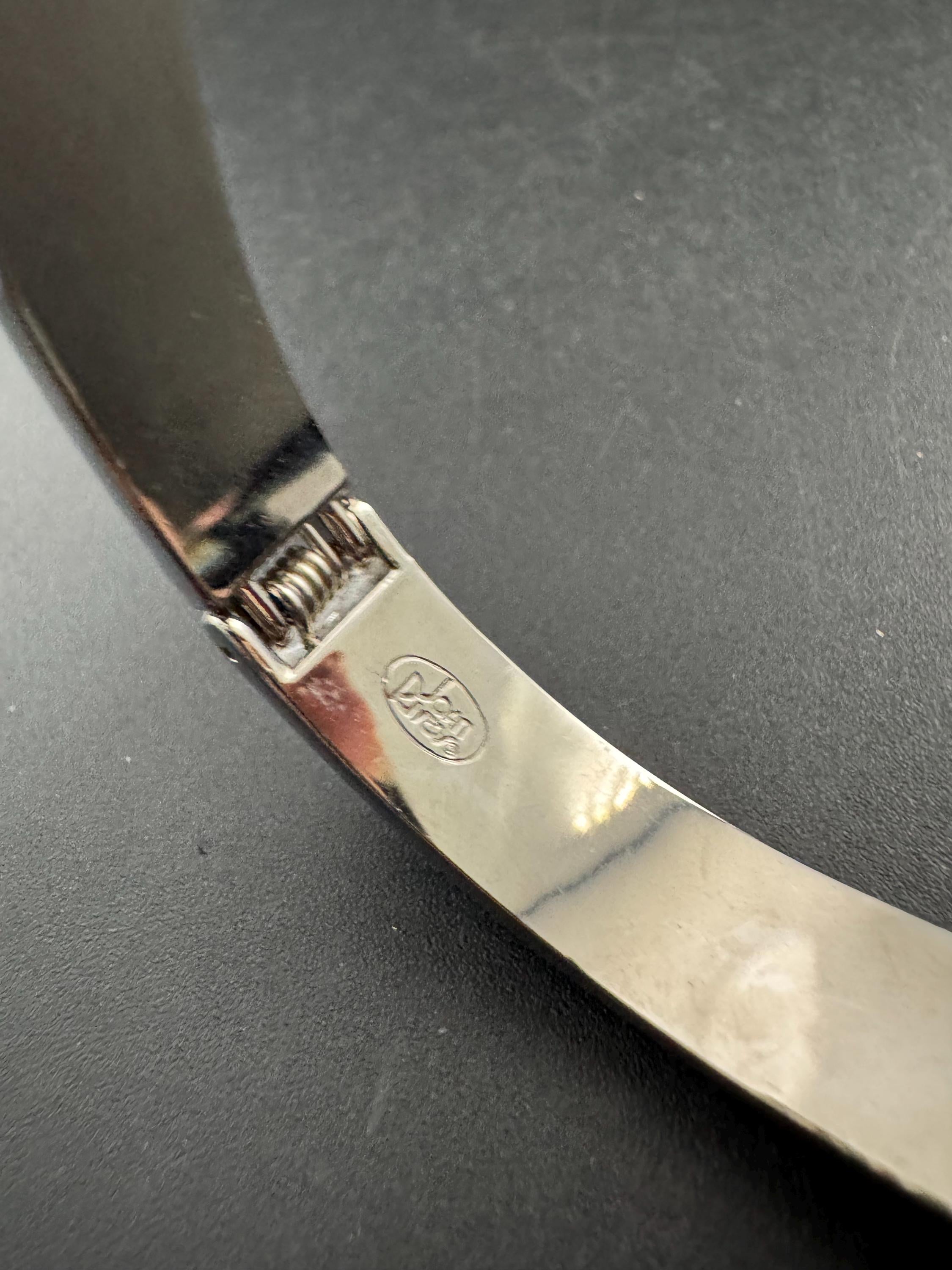 Signed Joan rivers denim blue clamper bangle: silver plated bracelet