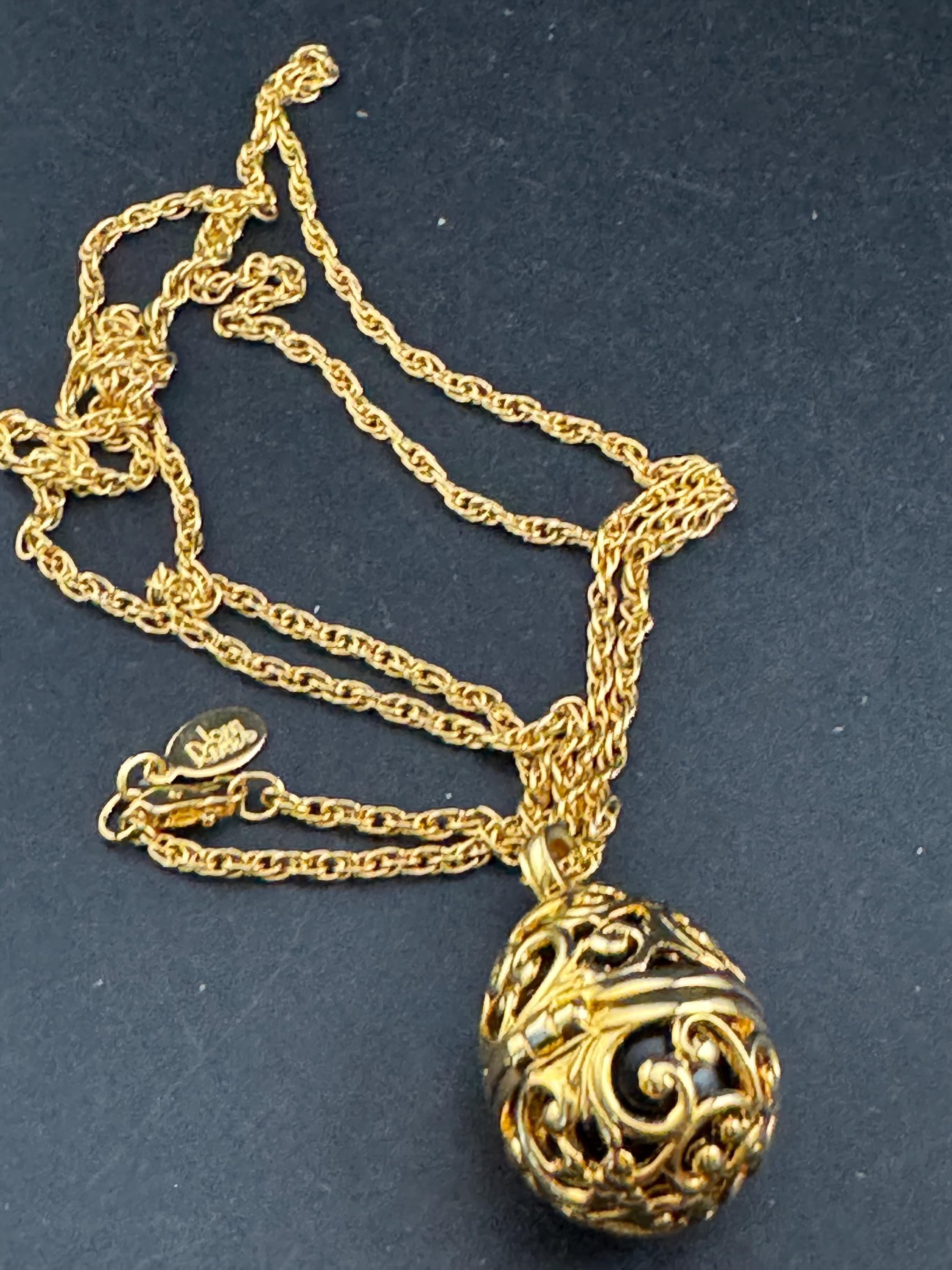 Joan Rivers black egg locket pendant necklace on 75cm chain, Faberge inspired