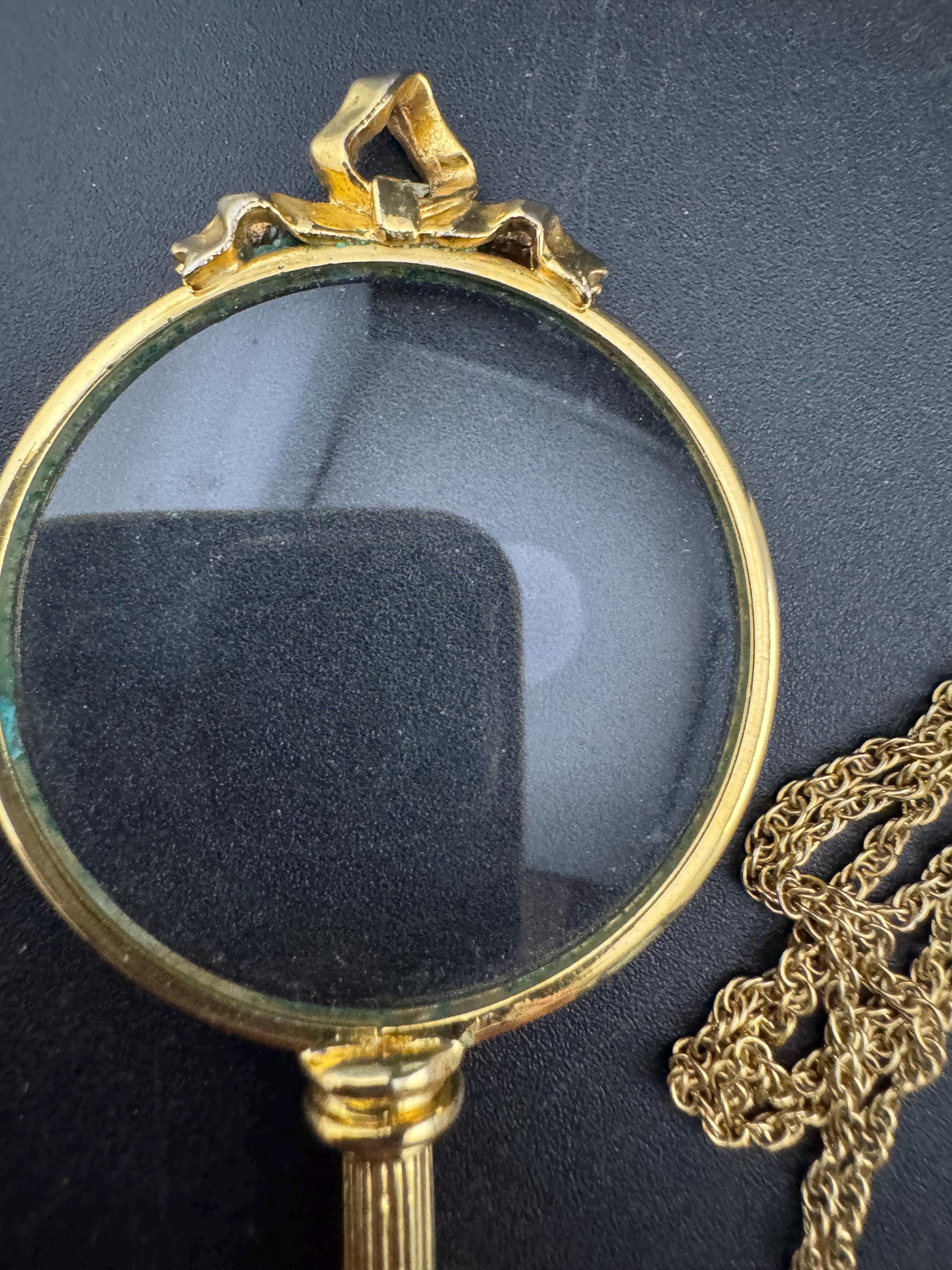 Signed Joan rivers ribbon top magnifier pendant necklace, gold plated magnifying jewellers loupe