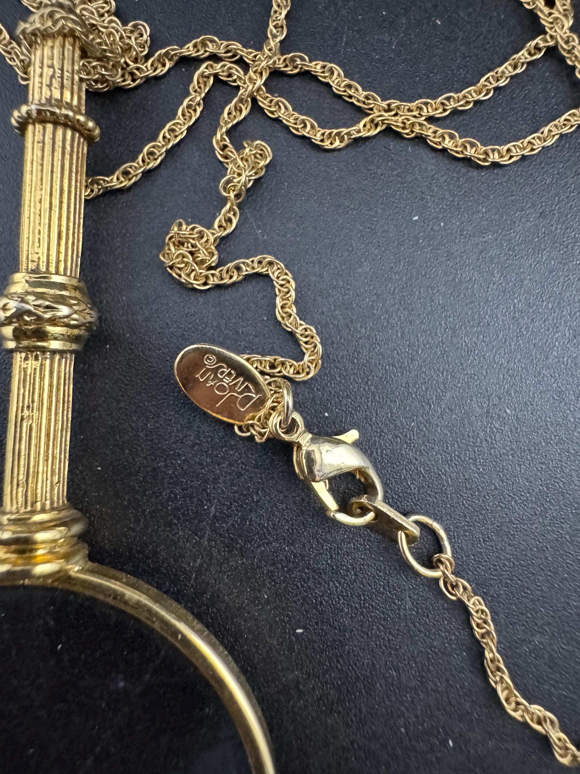 Signed Joan rivers ribbon top magnifier pendant necklace, gold plated magnifying jewellers loupe