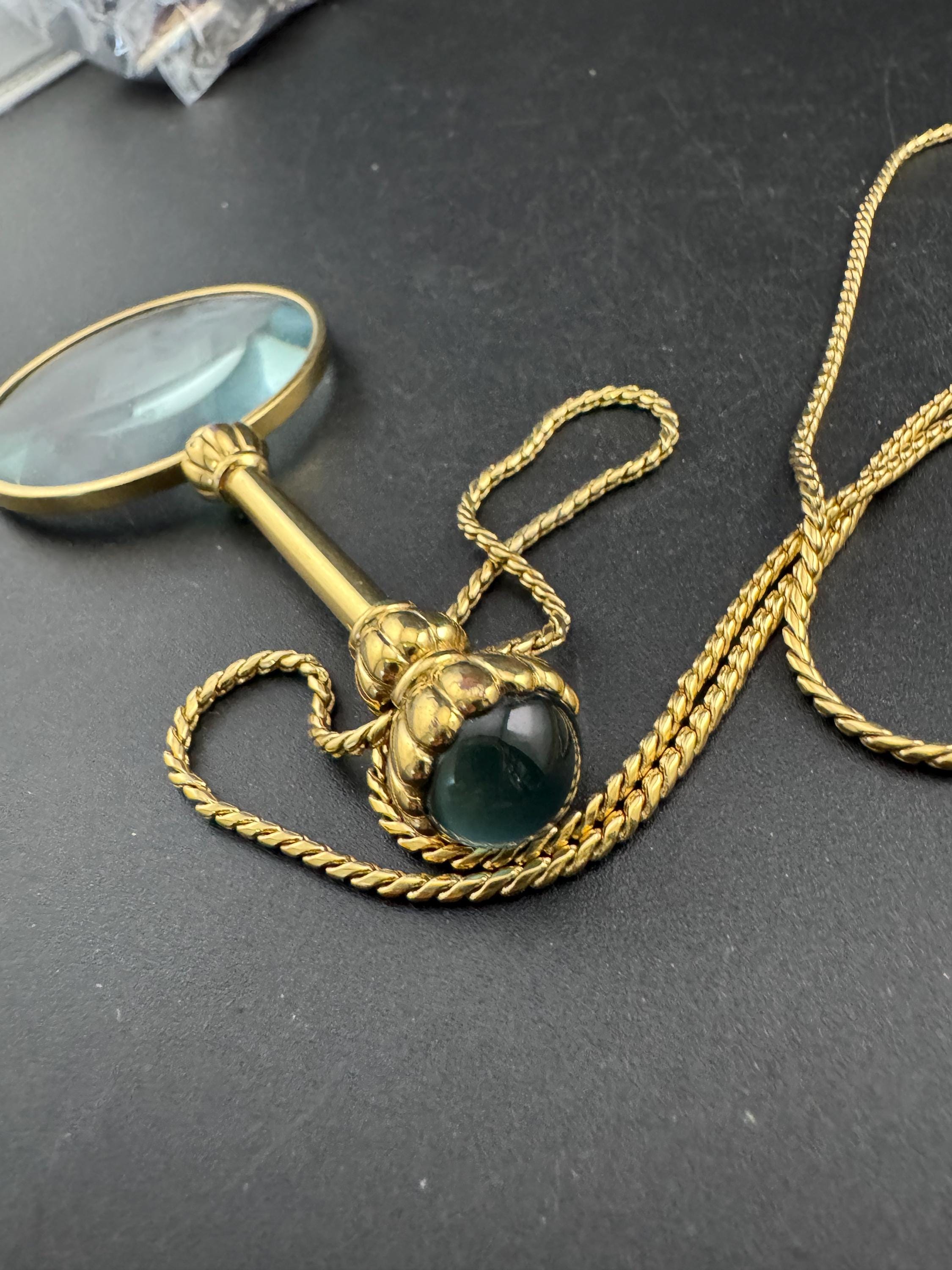 Vintage jewellers loupe eyeglass magnifier pendant necklace, gold plated with blue glass cabochon