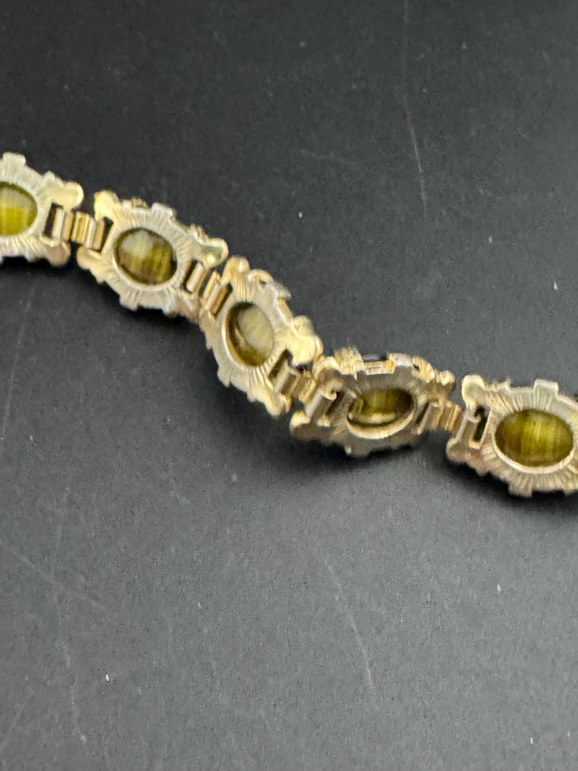 Vintage dark olive green Gold Tone panel link cocktail bracelet, givre glass marbled cabochons