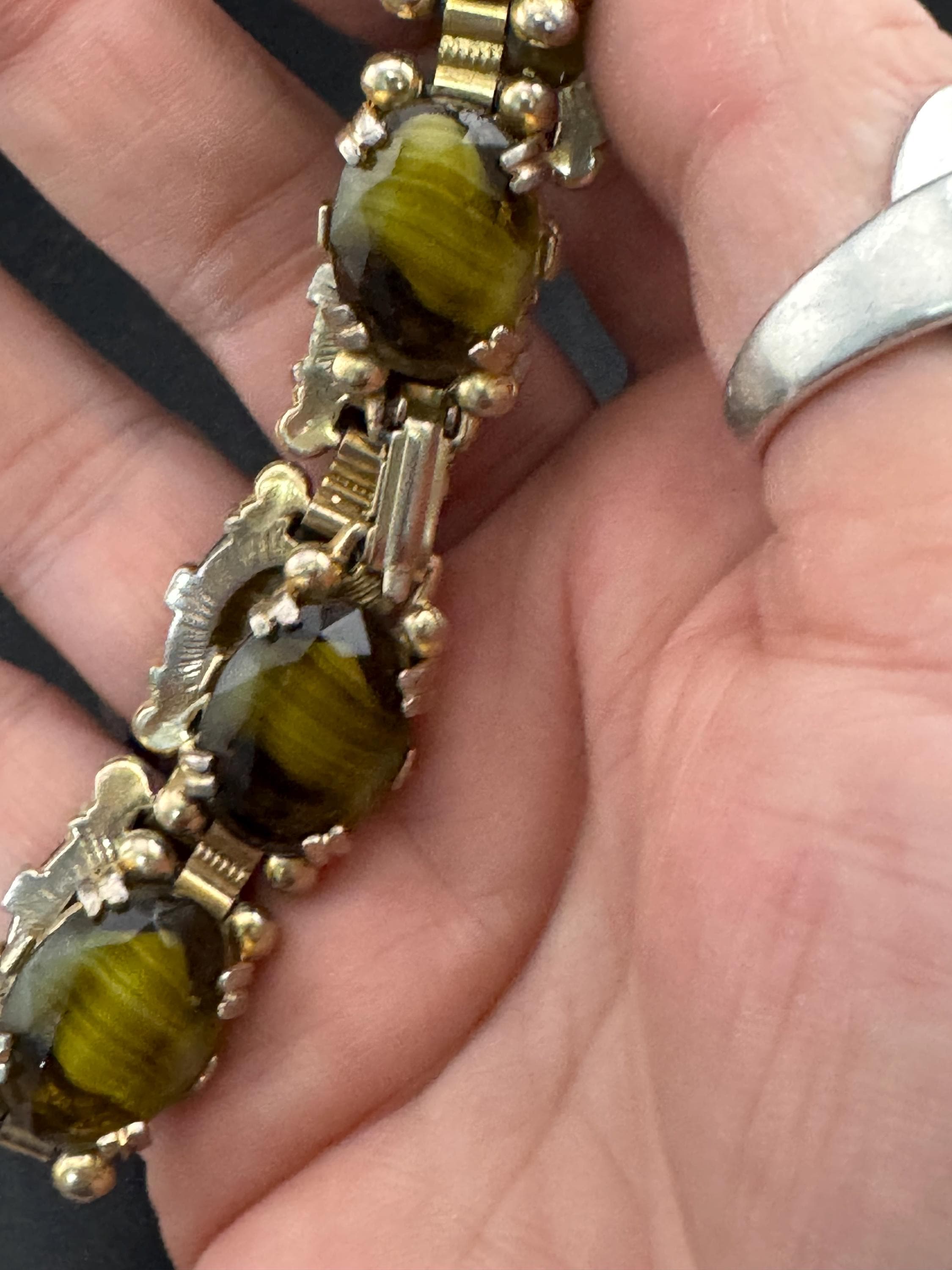 Vintage dark olive green Gold Tone panel link cocktail bracelet, givre glass marbled cabochons