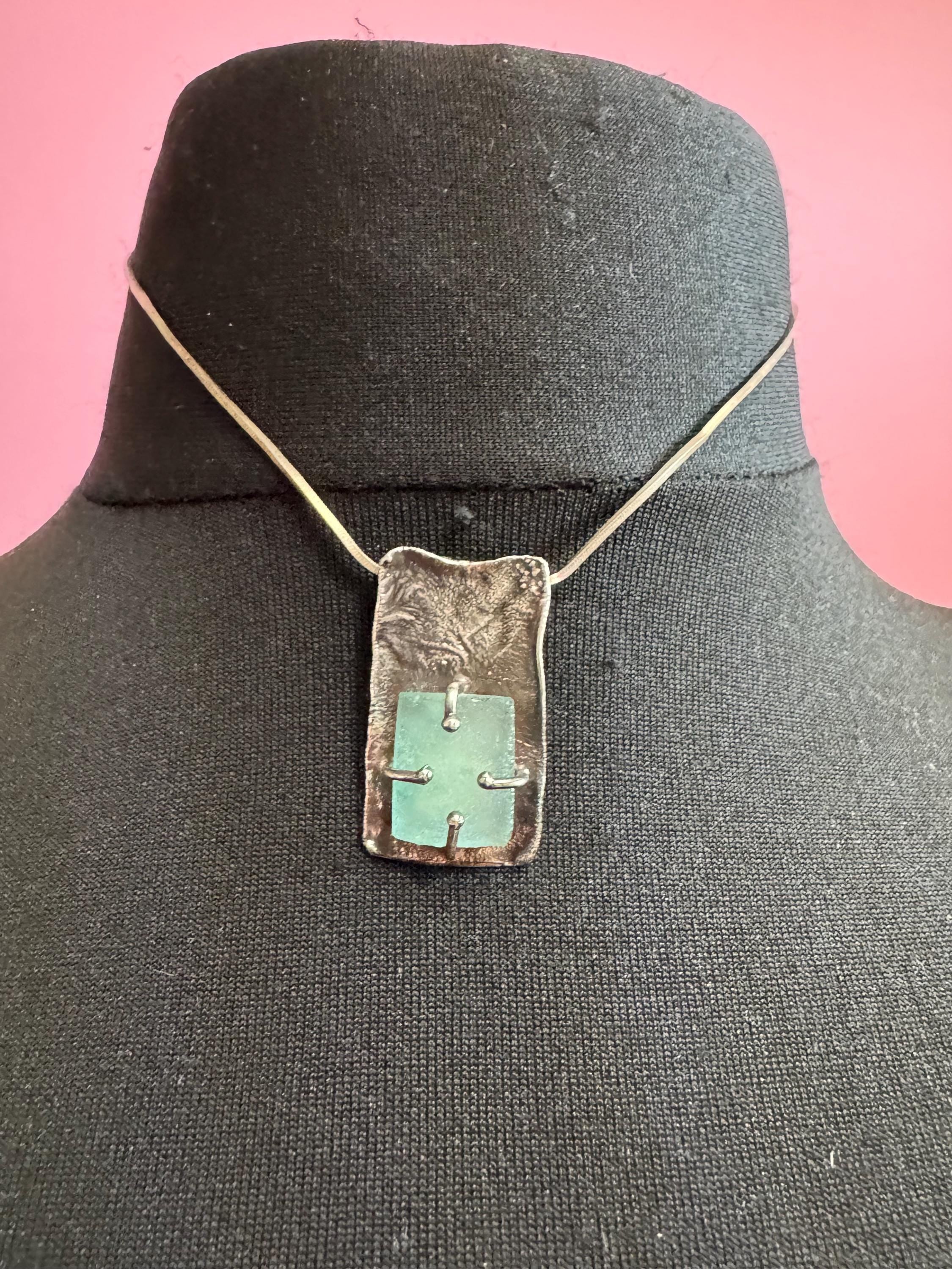 925 silver blue roman glass pendant by the artisan Luli Hamersztein.