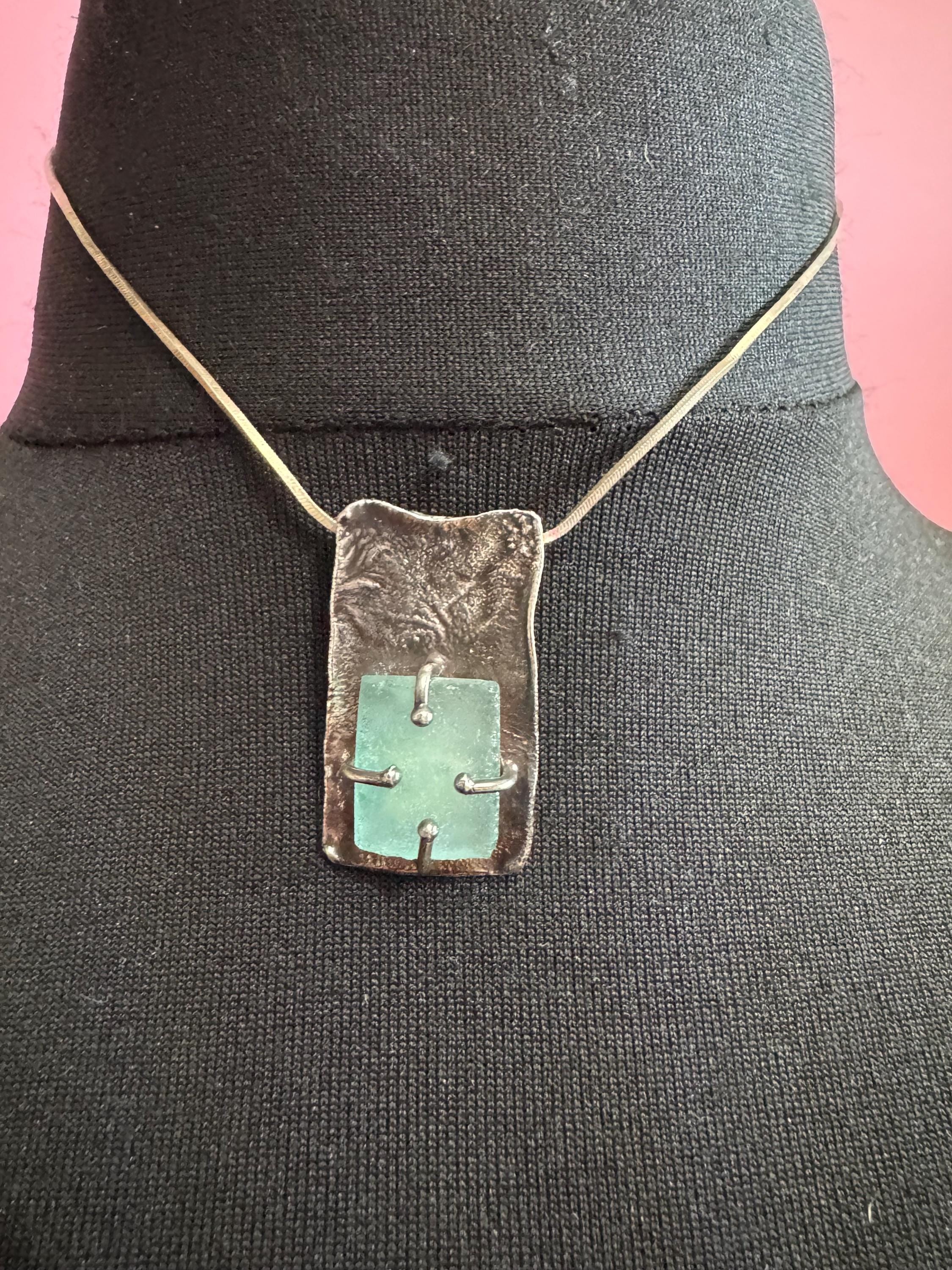 925 silver blue roman glass pendant by the artisan Luli Hamersztein.