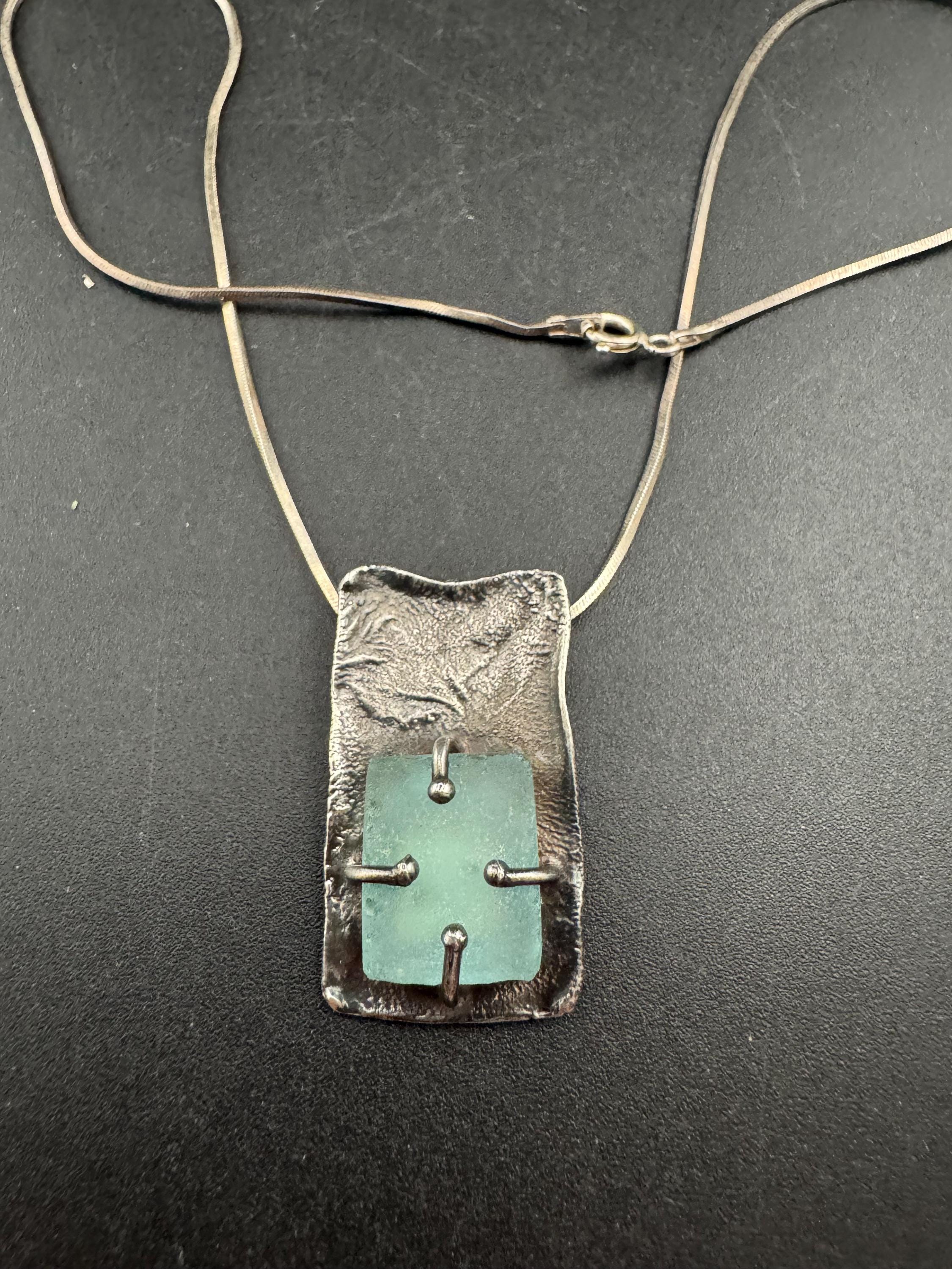 925 silver blue roman glass pendant by the artisan Luli Hamersztein.