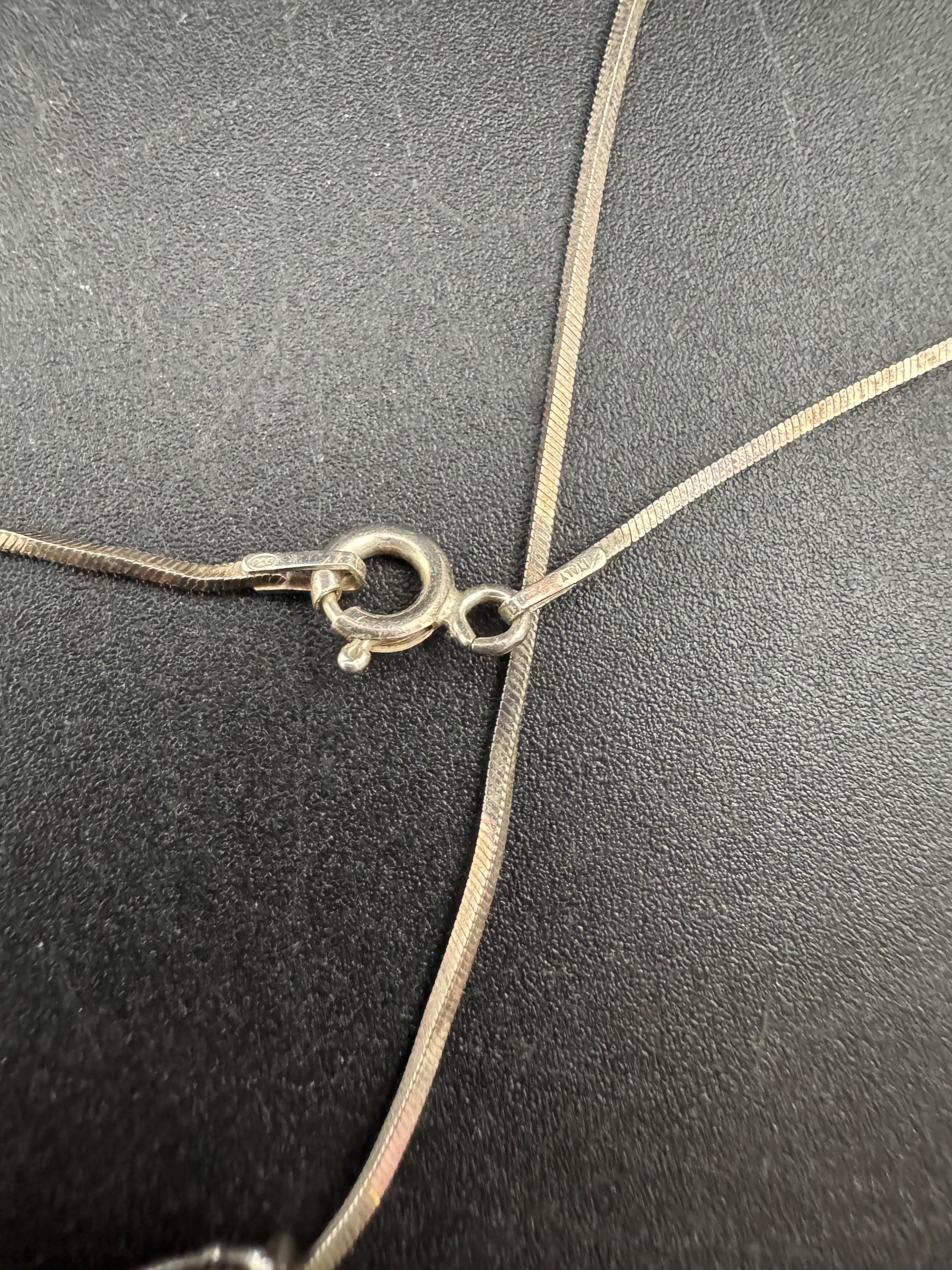 925 silver blue roman glass pendant by the artisan Luli Hamersztein.