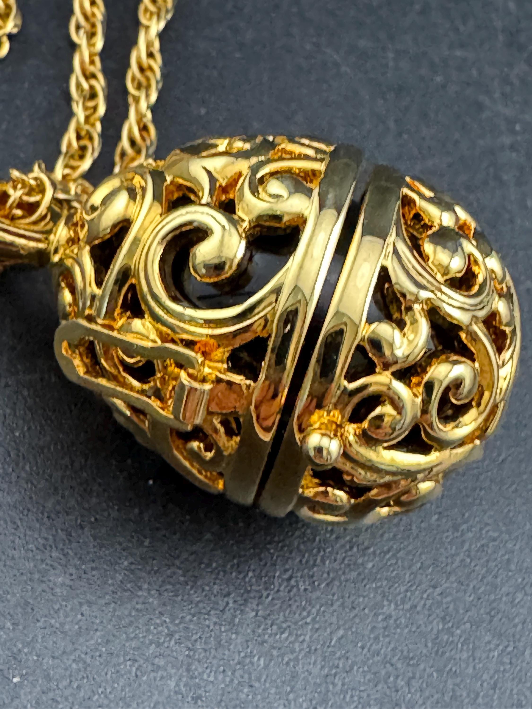 Joan Rivers black egg locket pendant necklace on 75cm chain, Faberge inspired