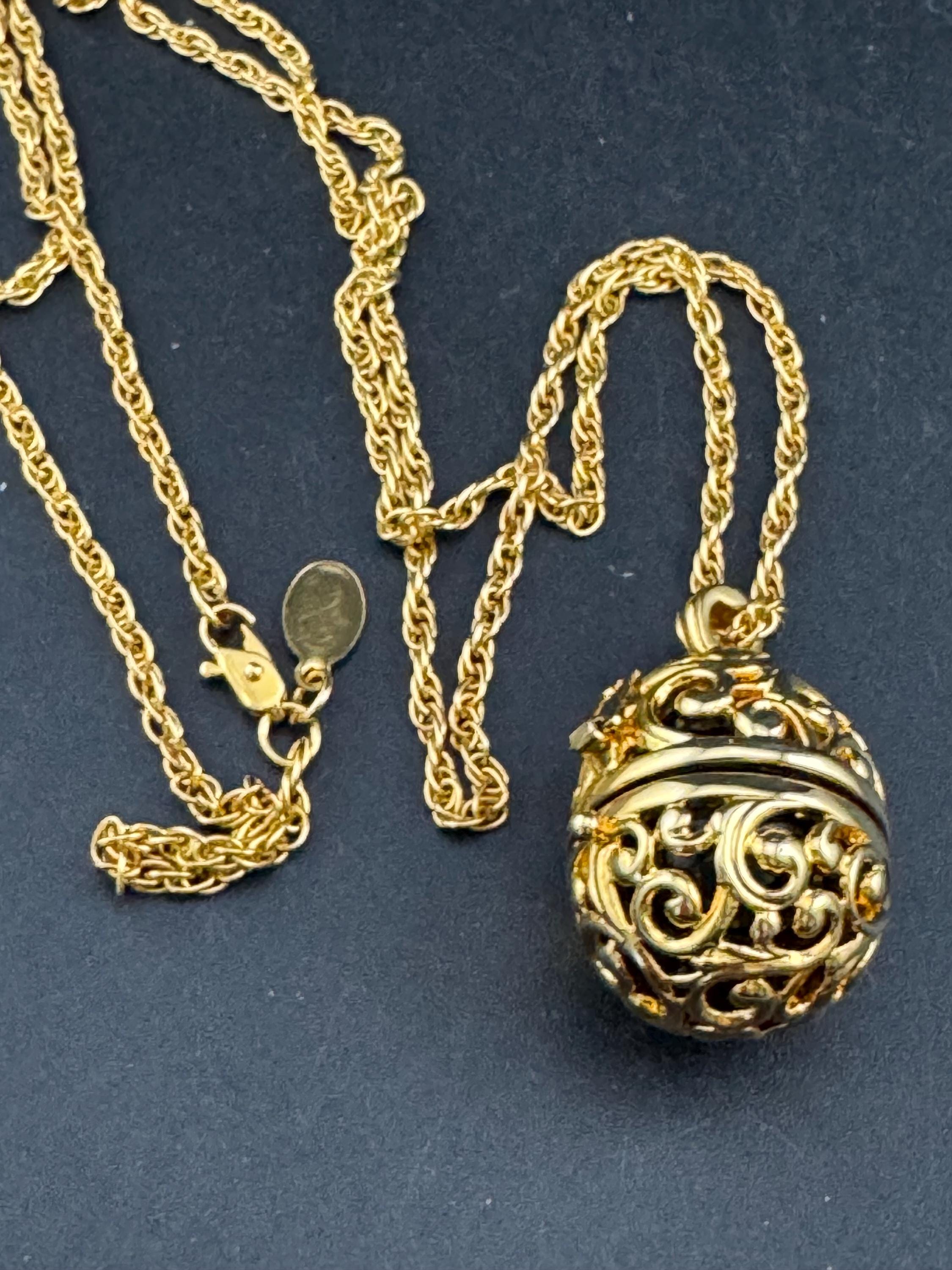 Joan Rivers black egg locket pendant necklace on 75cm chain, Faberge inspired
