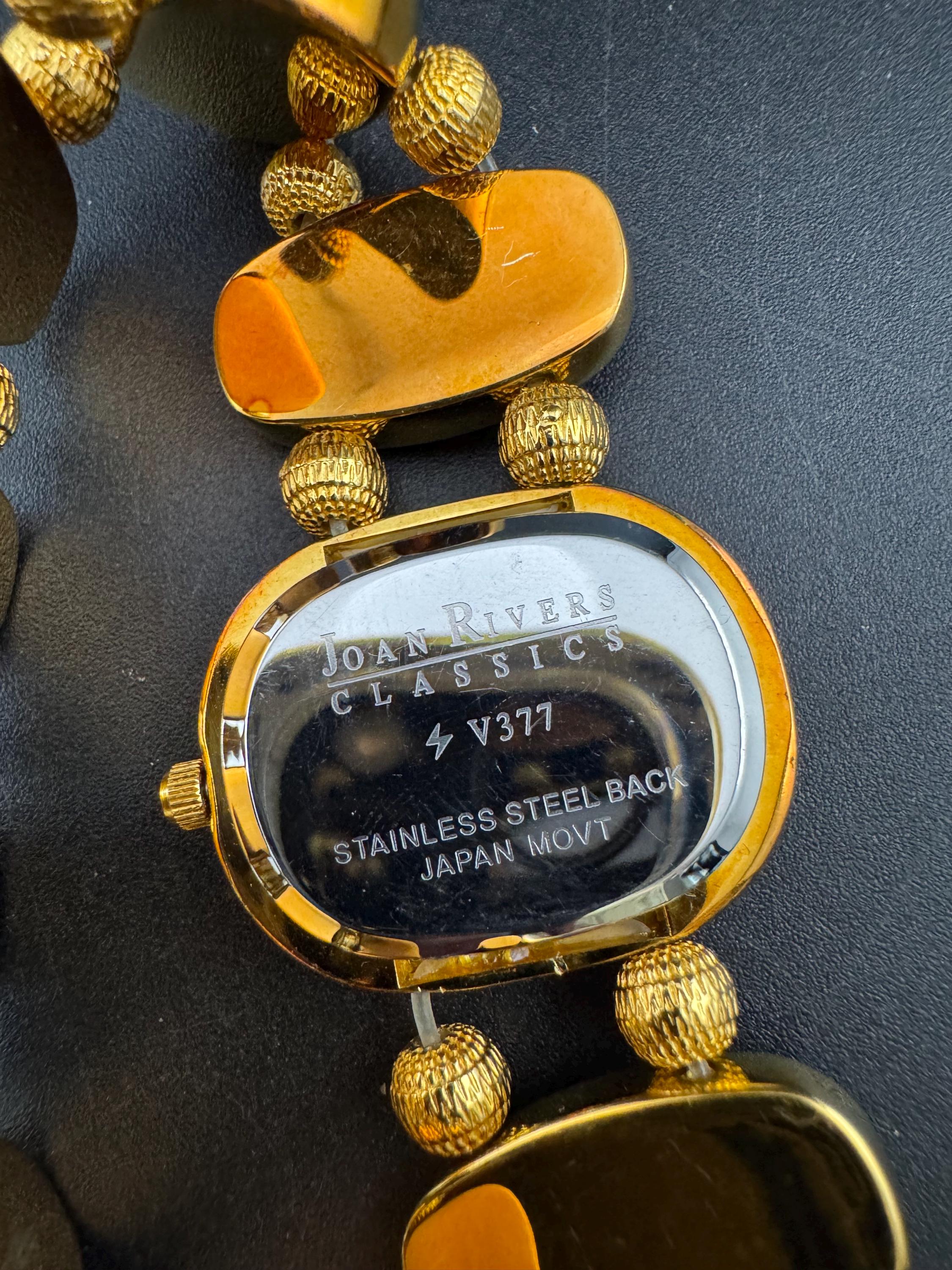 Signed Joan rivers enamelled floral panel link bracelet watch, elasticated