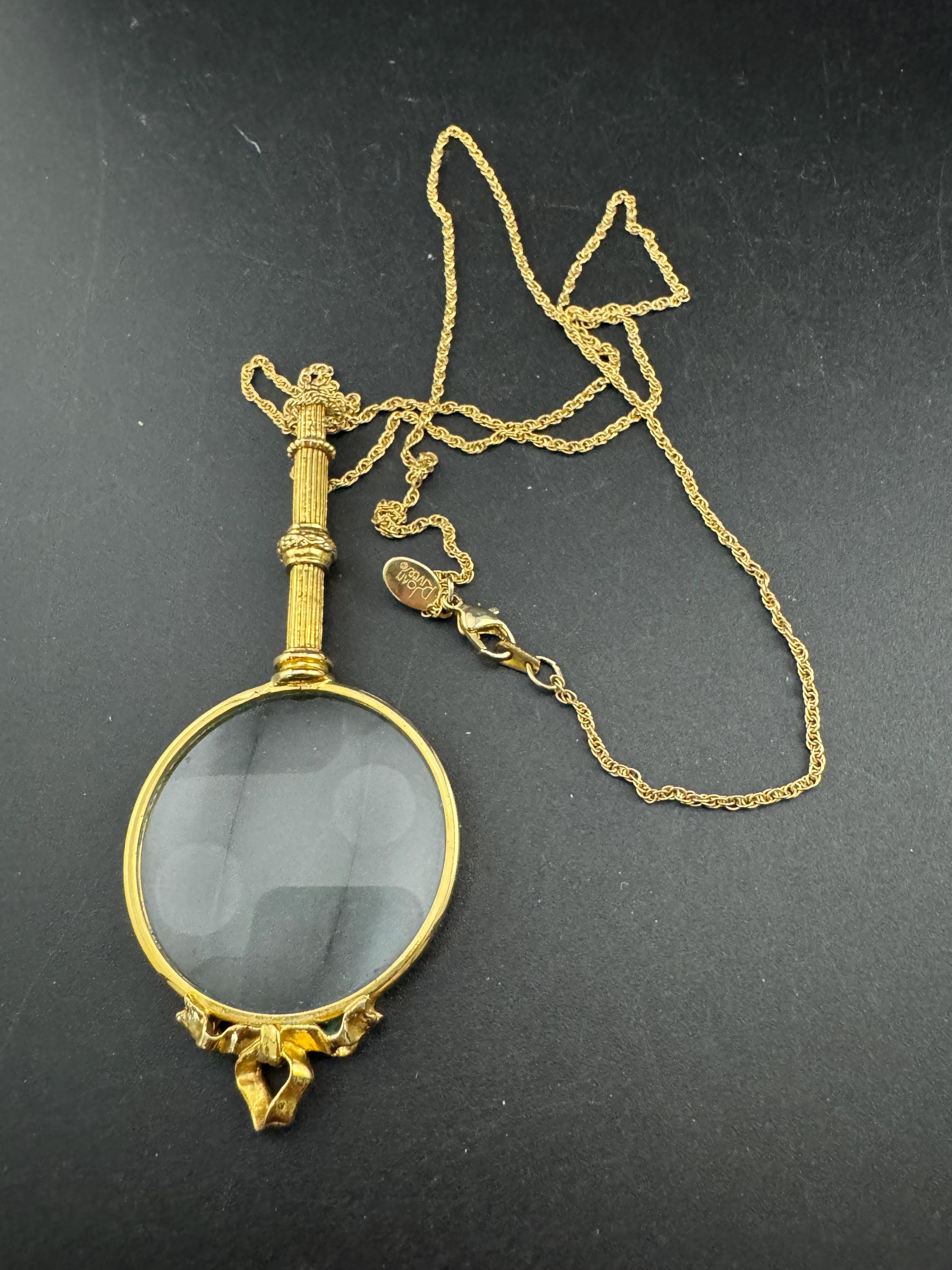 Signed Joan rivers ribbon top magnifier pendant necklace, gold plated magnifying jewellers loupe