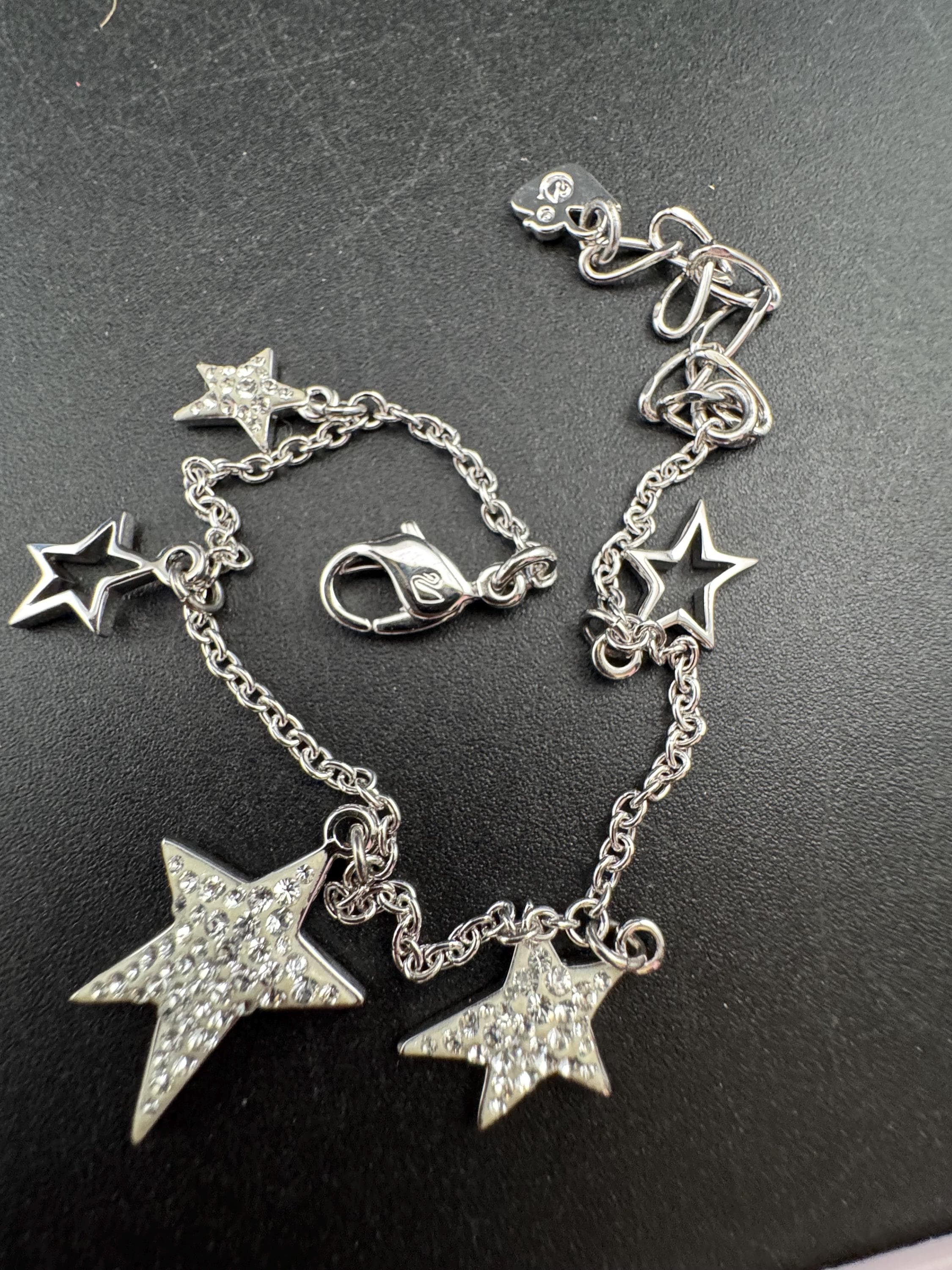 Swarovski crystal star charm bracelet , rhodium plated signed swan