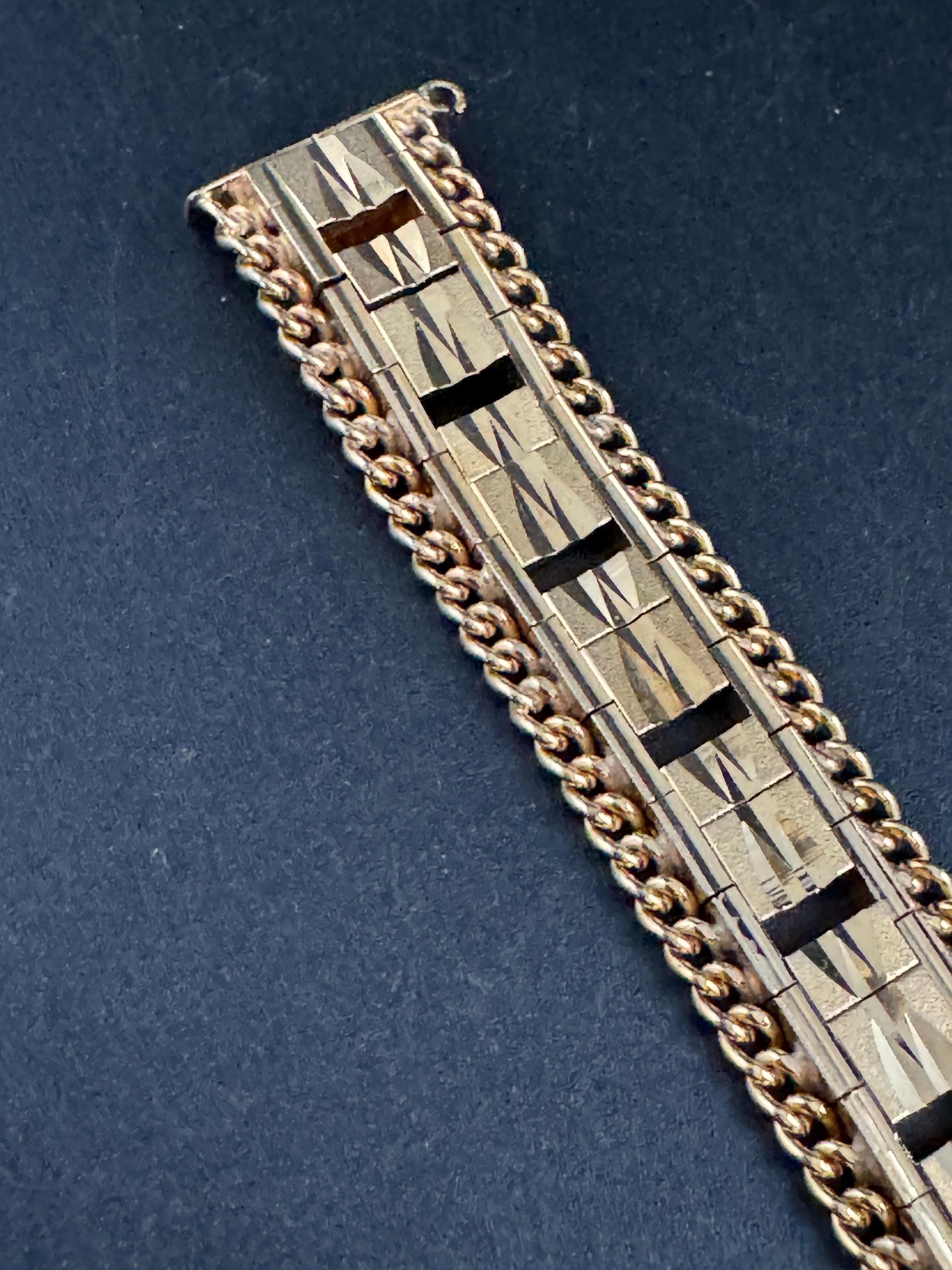 1970s flat wide etched bracelet,  gold plated chain edged openwork