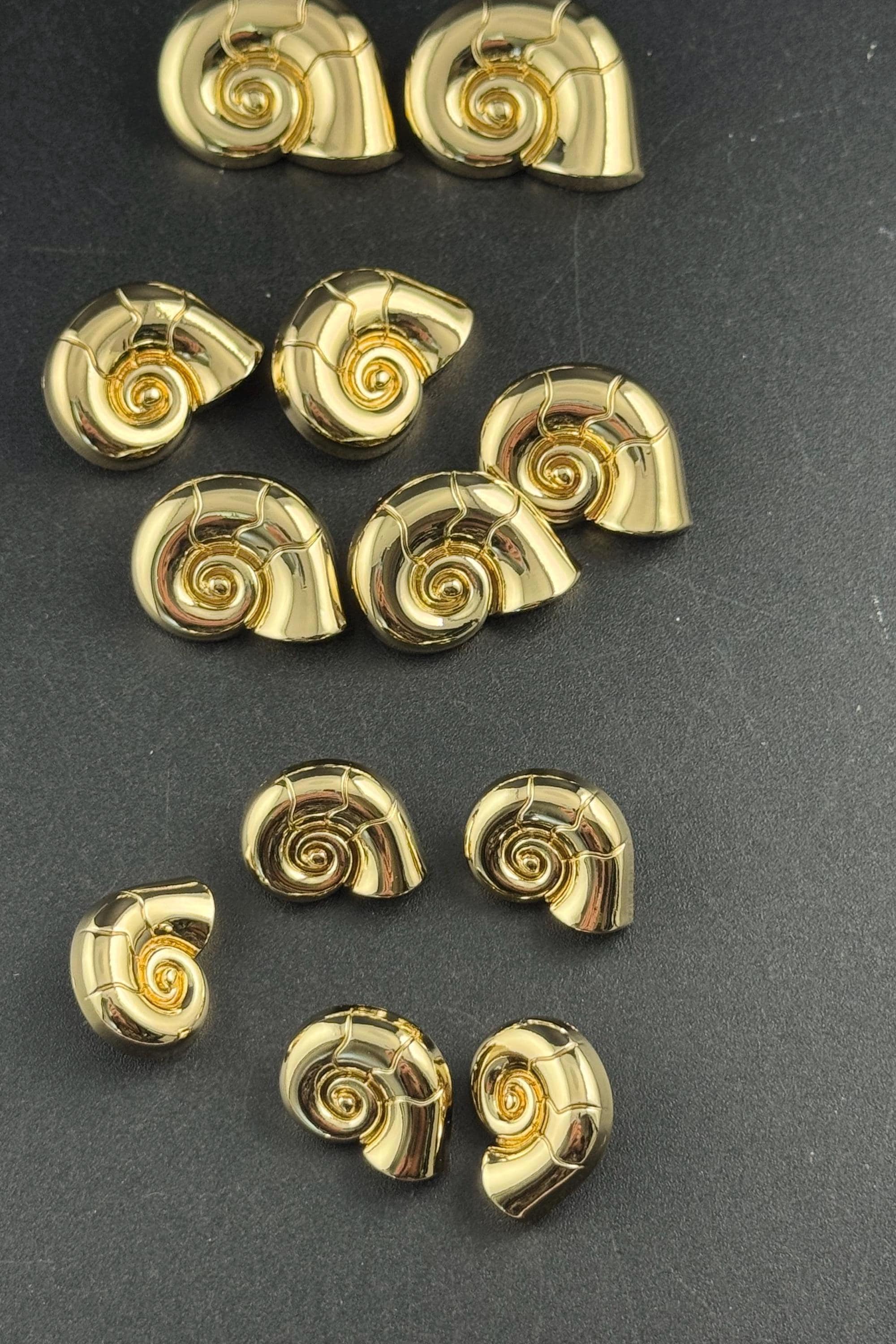 Gold ammonite shell sewing buttons, three sizes 30mm 23mm 20mm