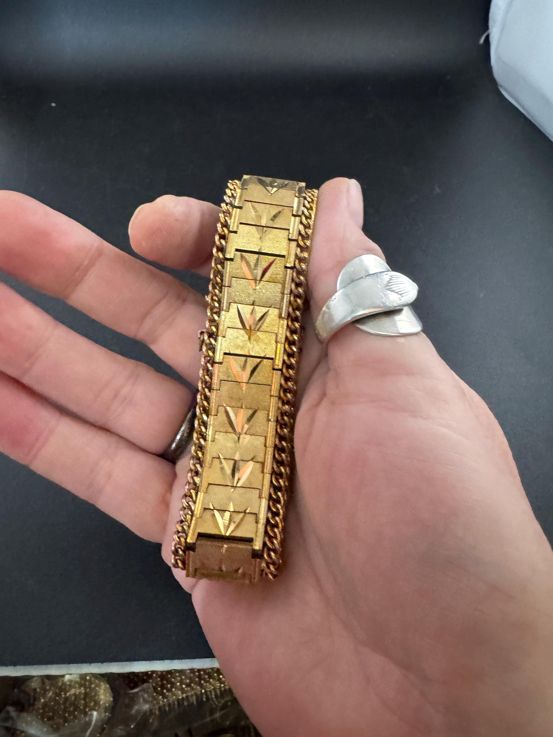 1970s flat wide etched bracelet,  gold plated chain edged with safety chain