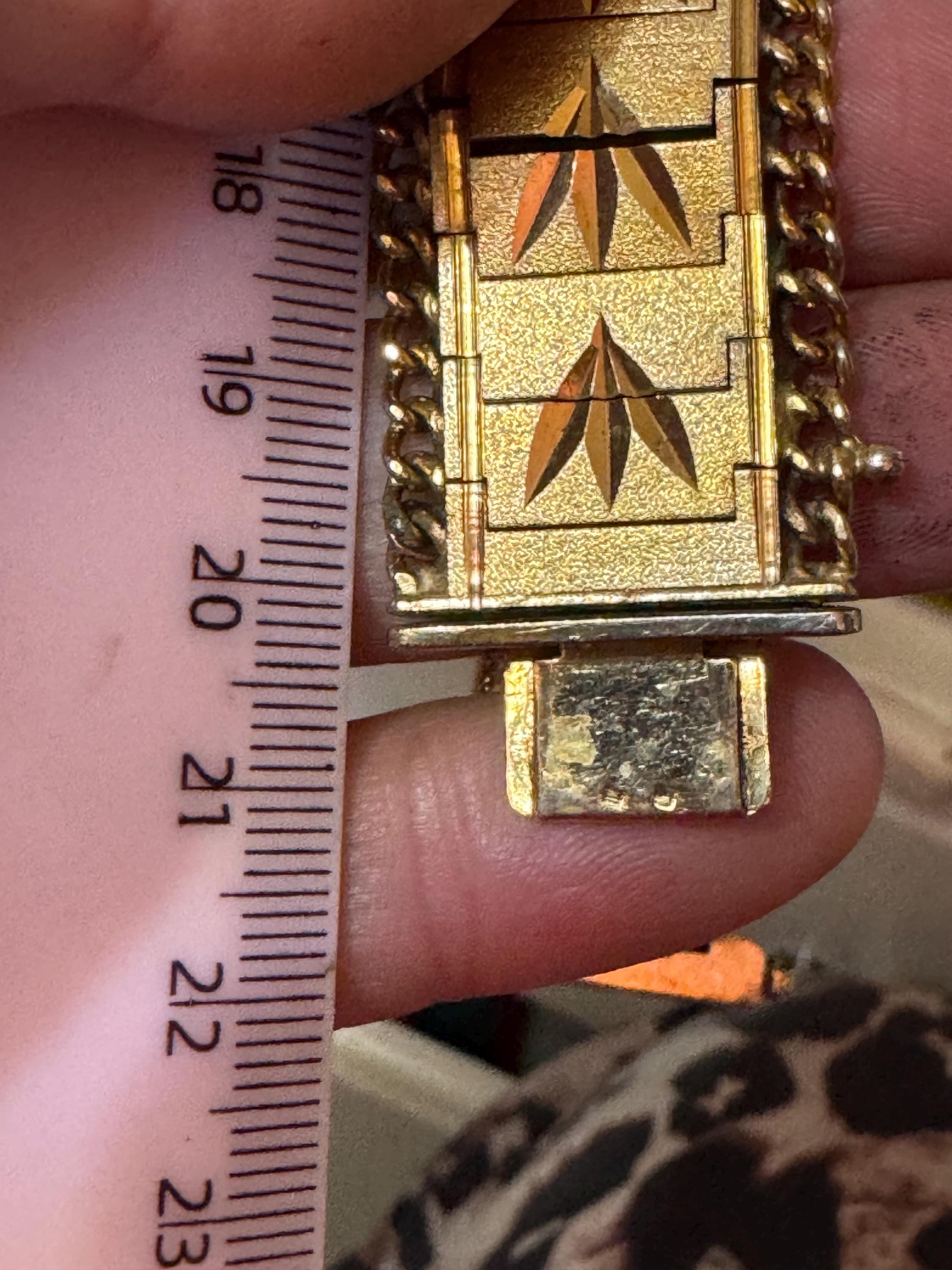 1970s flat wide etched bracelet,  gold plated chain edged with safety chain