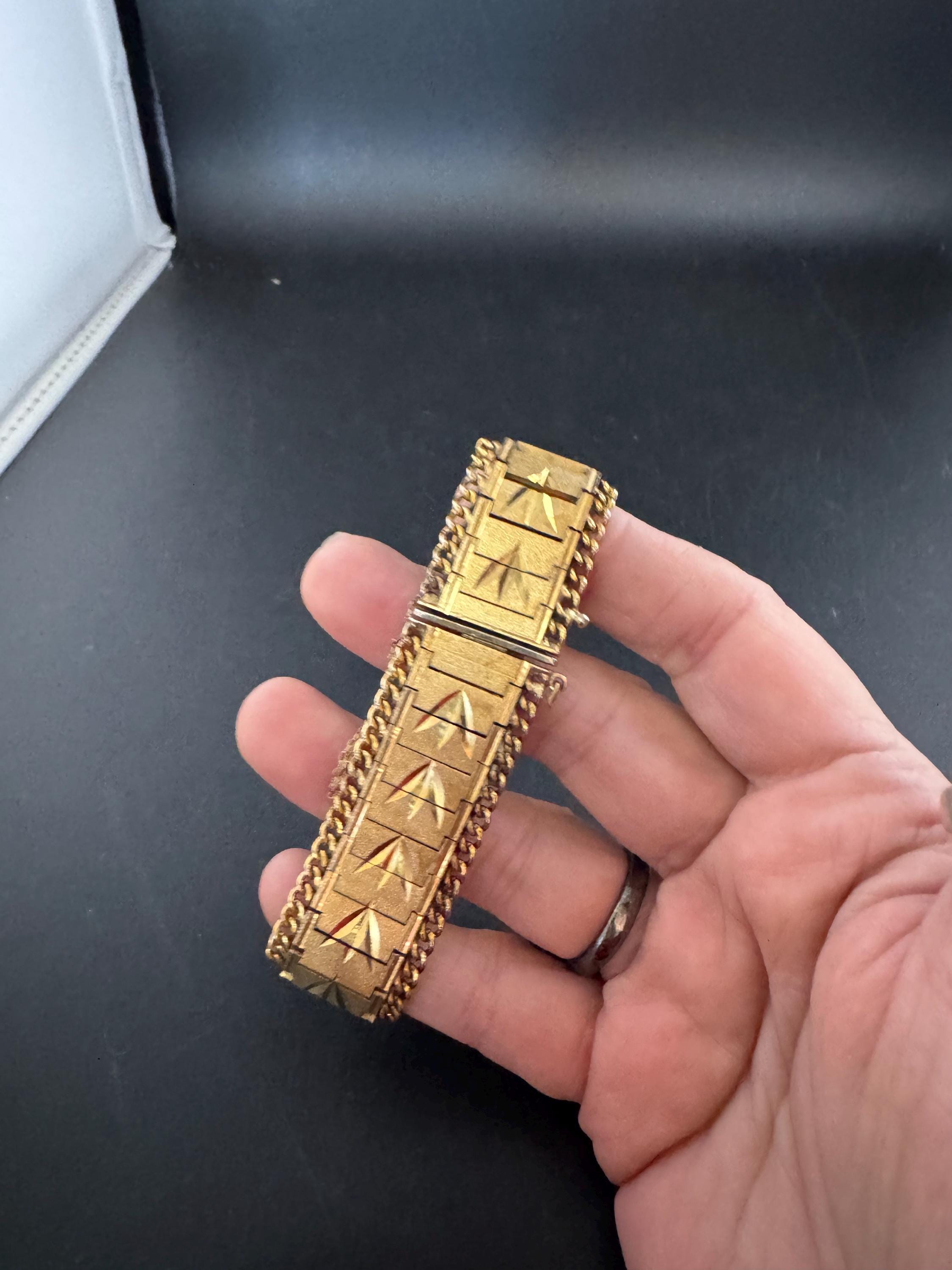 1970s flat wide etched bracelet,  gold plated chain edged with safety chain