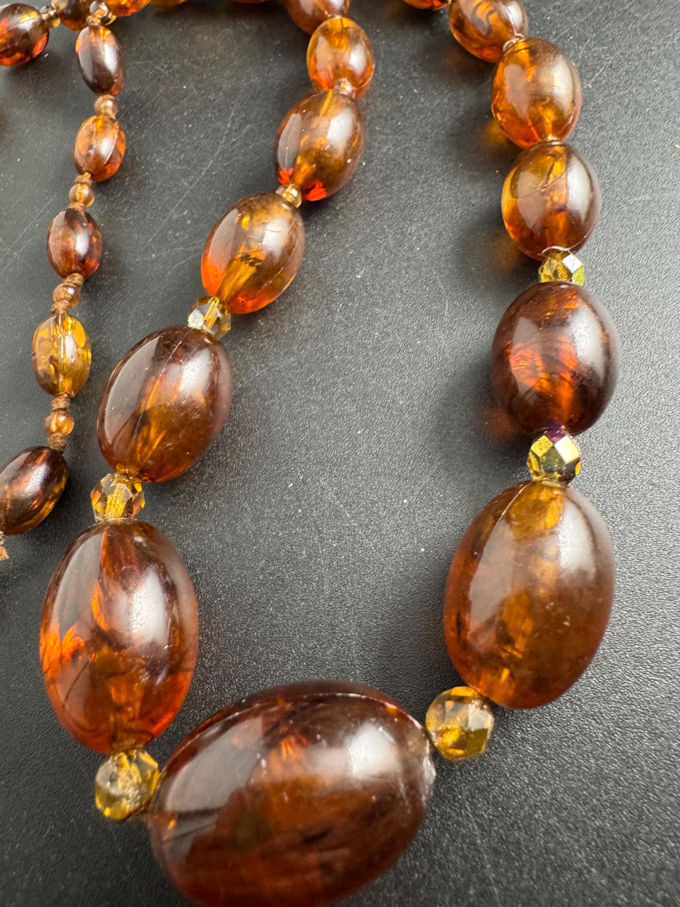 Long Faux Amber orange brown beaded necklace, oval plastic beads