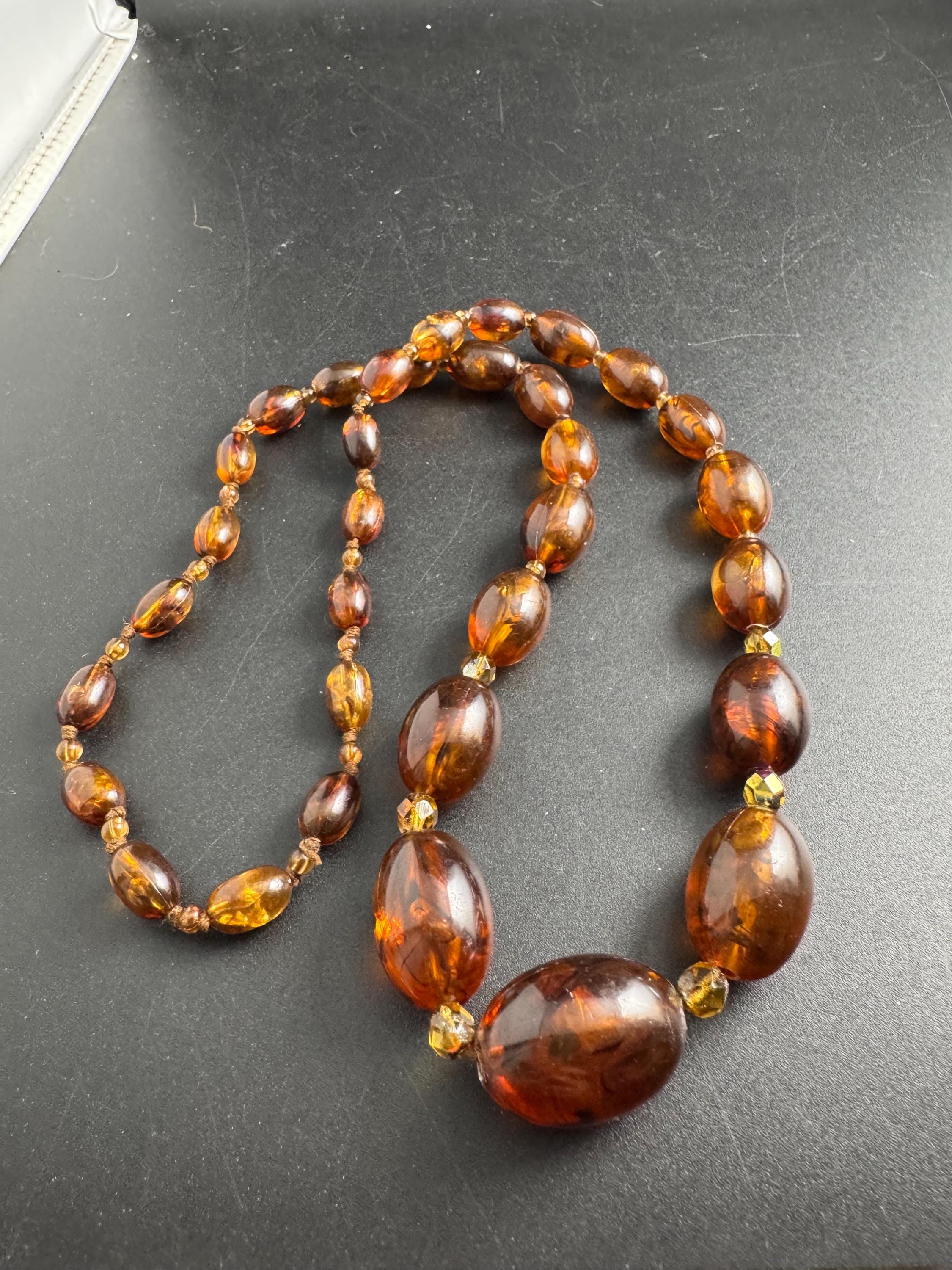 Long Faux Amber orange brown beaded necklace, oval plastic beads