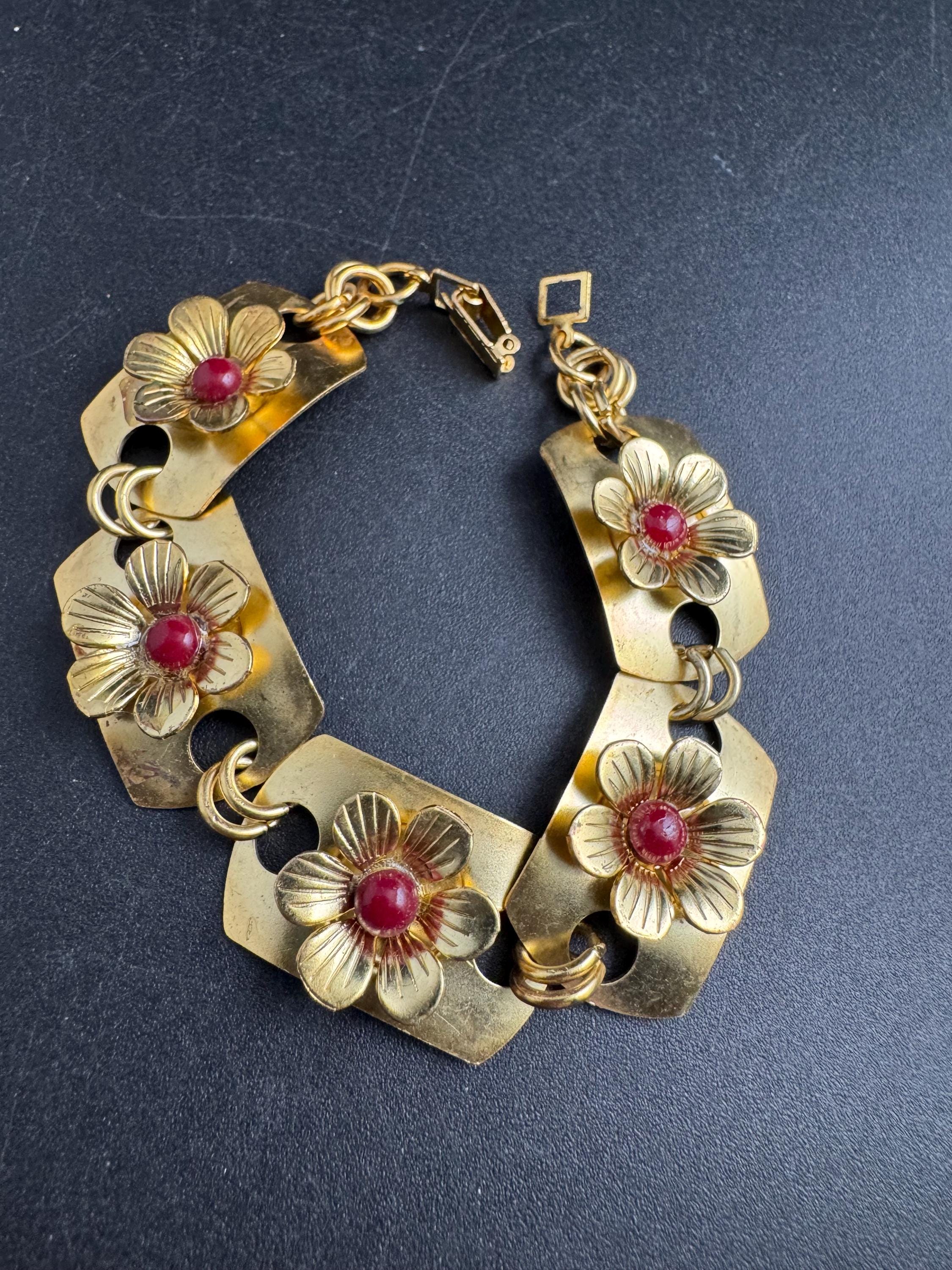 Art deco brass panel link flower bracelet , red cabochons vintage unused mid century