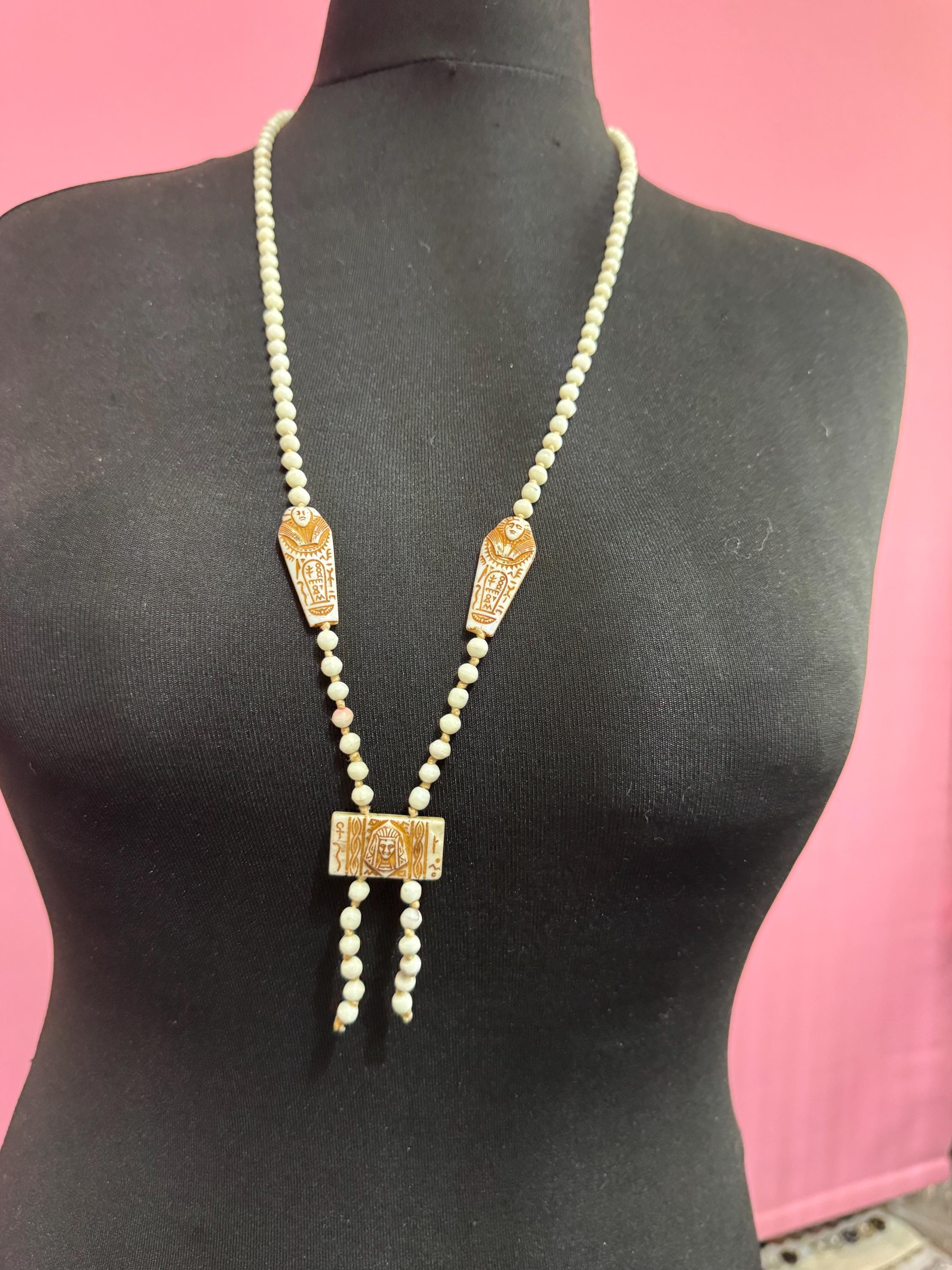 neiger UV coffin necklace, cream beads 84cm uranium glass