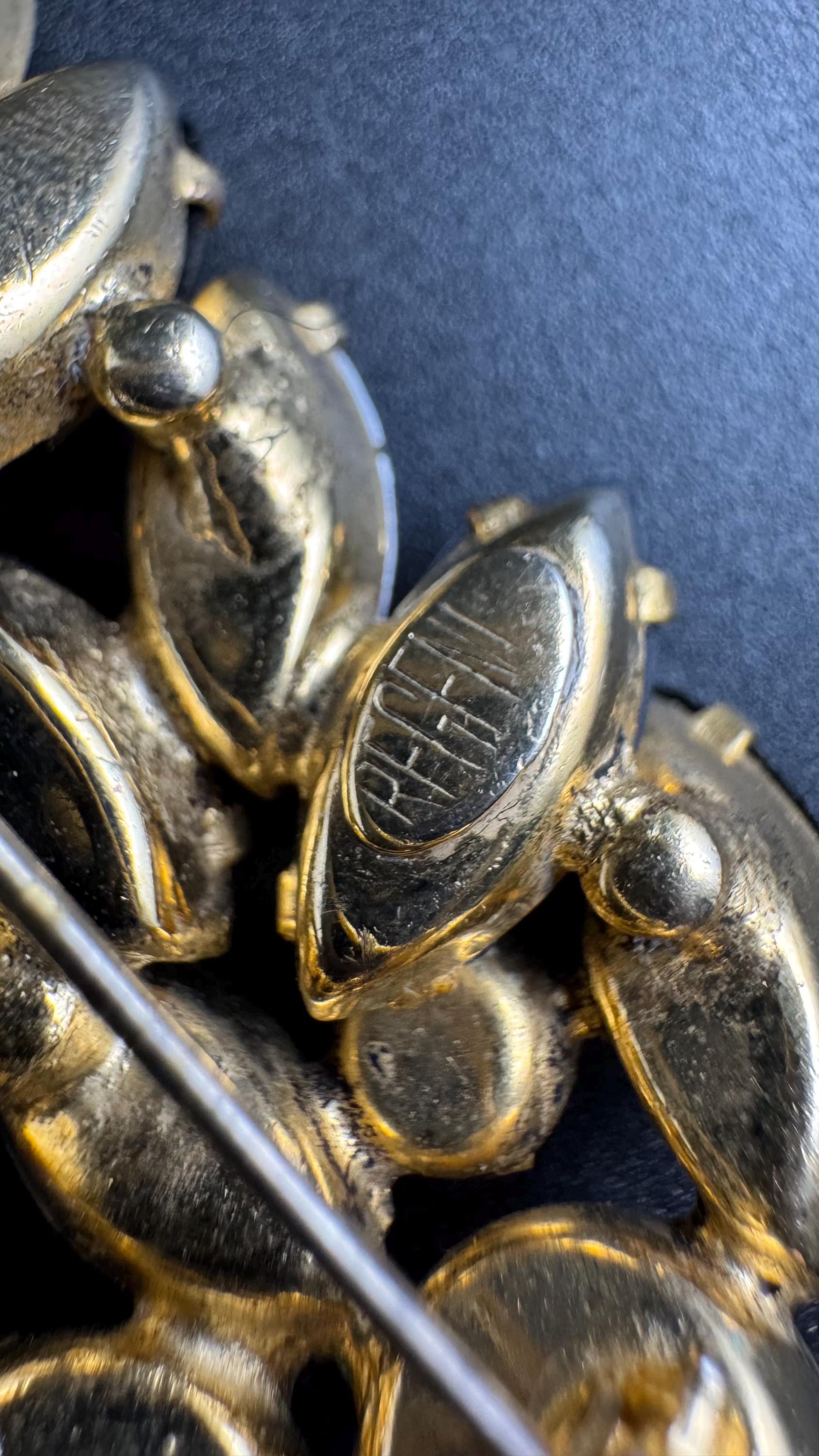 Regency AB rhinestone brooch, Aurora borealis and bronze stones