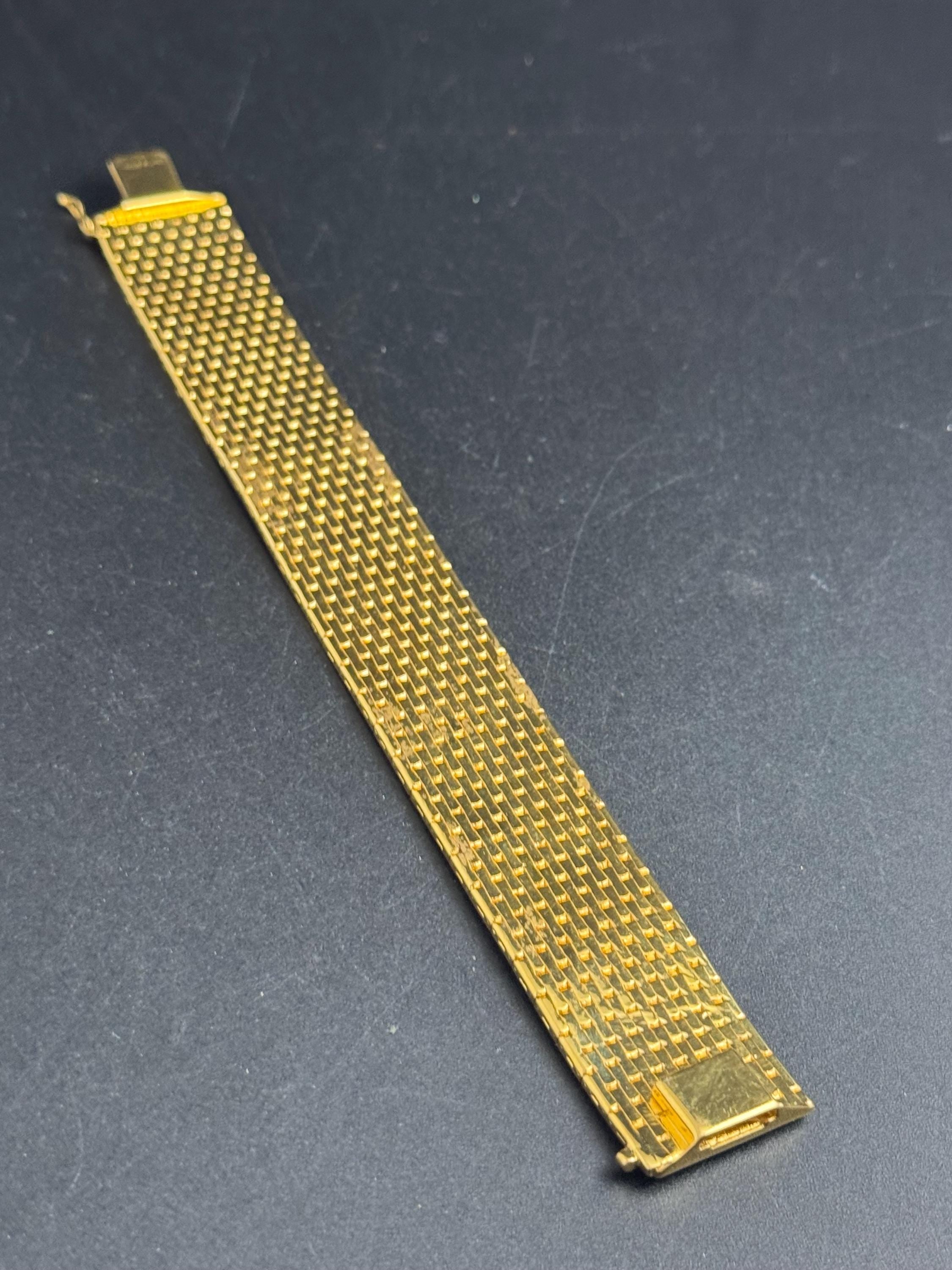 Wide gold plated flat bracelet, articulated 1970s